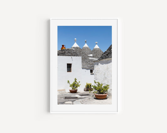 Vertical photo of trulli rooftops and white walls in Alberobello, Italy – Mediterranean architecture travel print