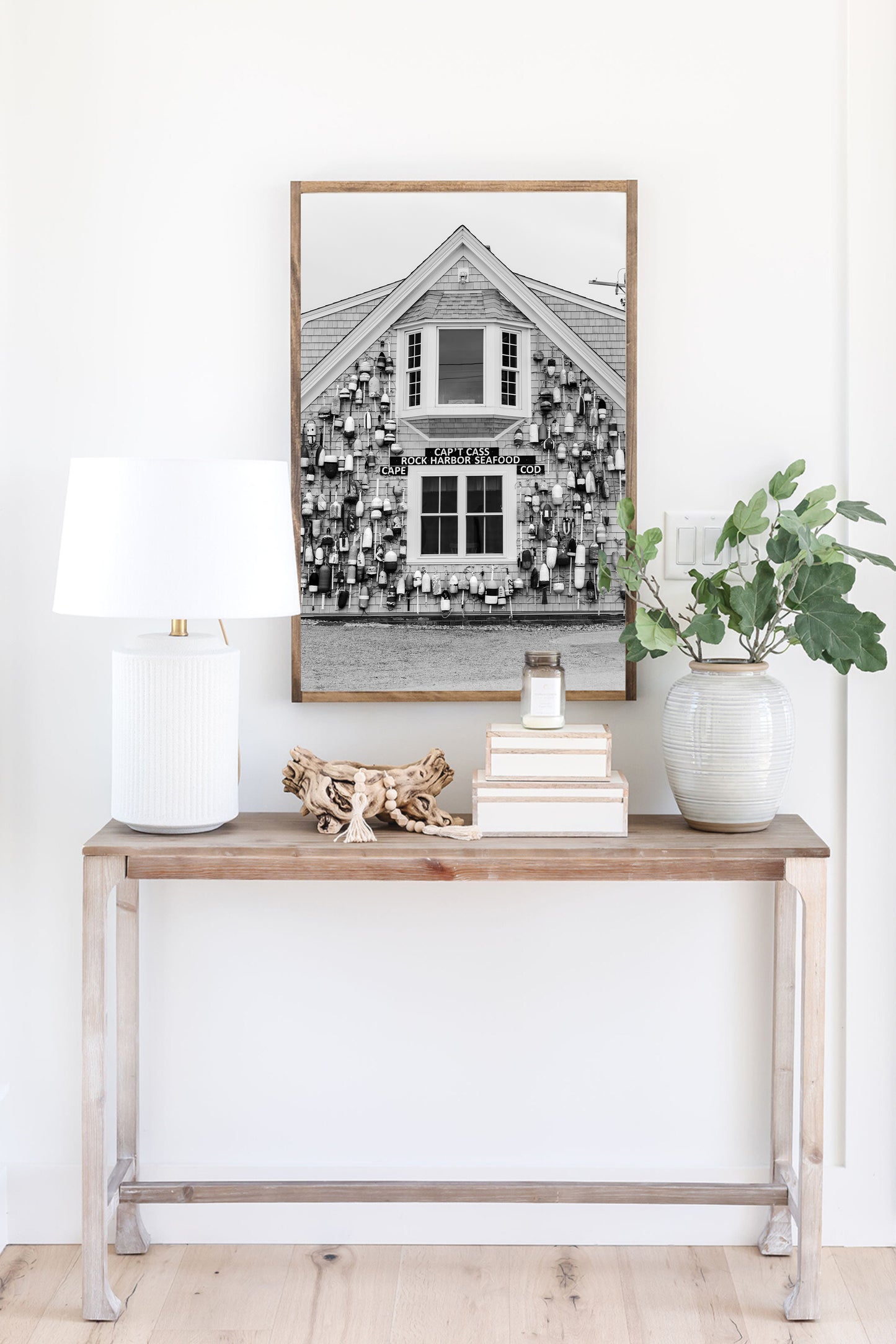 Black and white coastal wall art of Cape Cod seafood shack covered in lobster buoys — perfect for nautical and rustic New England decor.