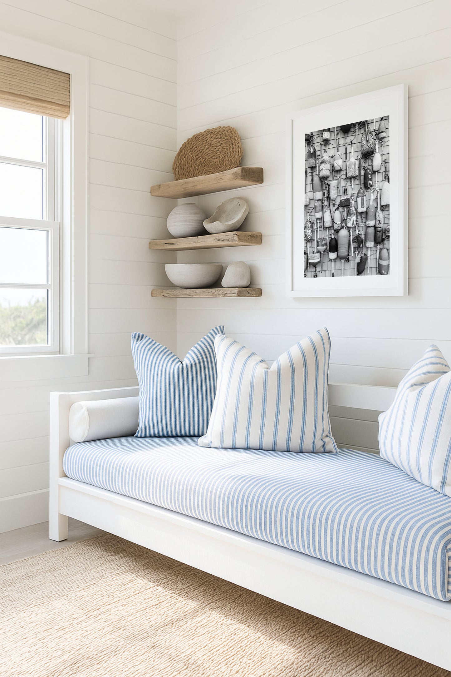Black and white photograph of weathered fishing buoys hanging on a wood wall, captured in Cape Cod. Nautical wall art with a rustic coastal feel.