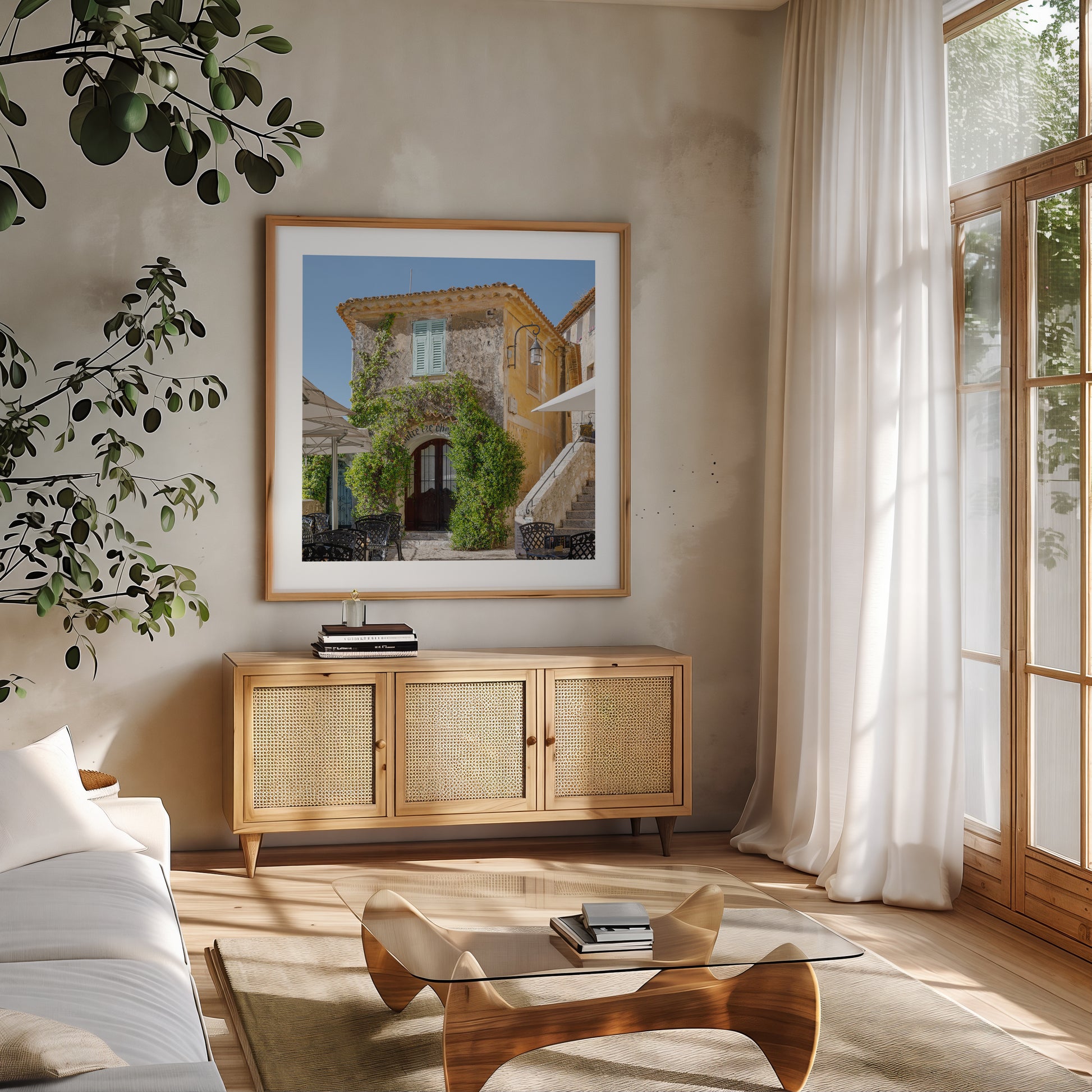Square color print of a sunlit building in the village of Èze, featuring light blue shutters, ivy-covered stone walls, and a patio table—perfect for French country decor and Côte d’Azur inspired styling.