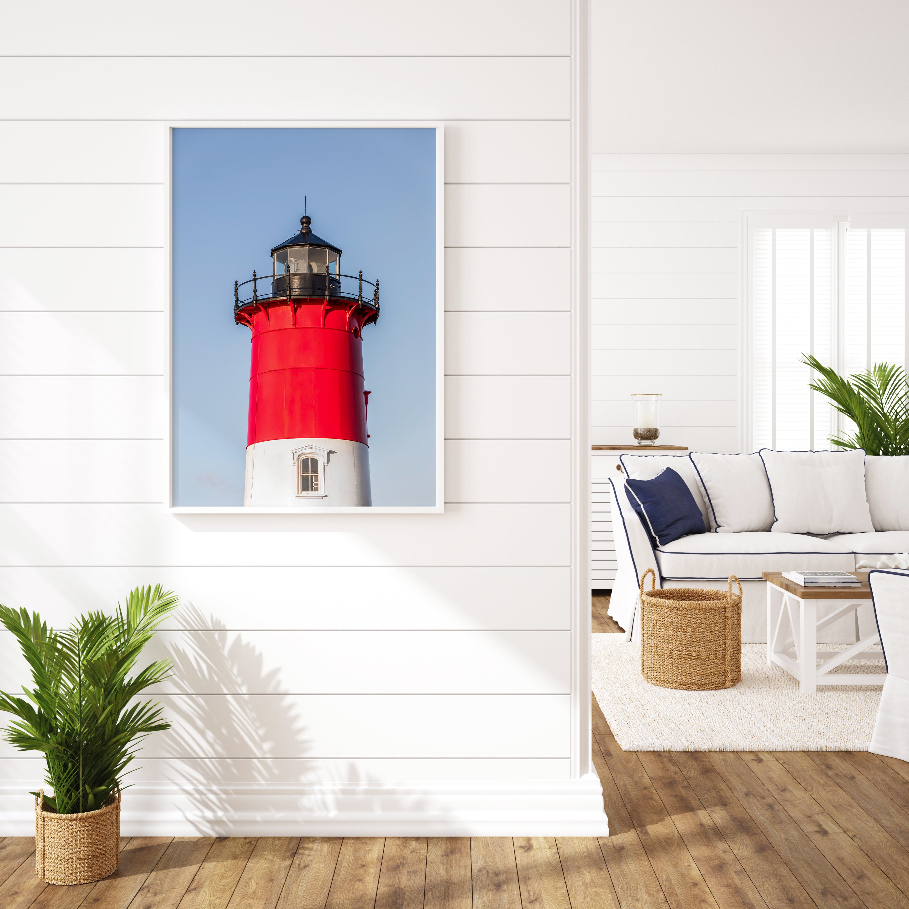 Vertical photograph of the red and white Nauset Lighthouse in Eastham, Massachusetts, set against a clear blue sky with no dunes or beach in view