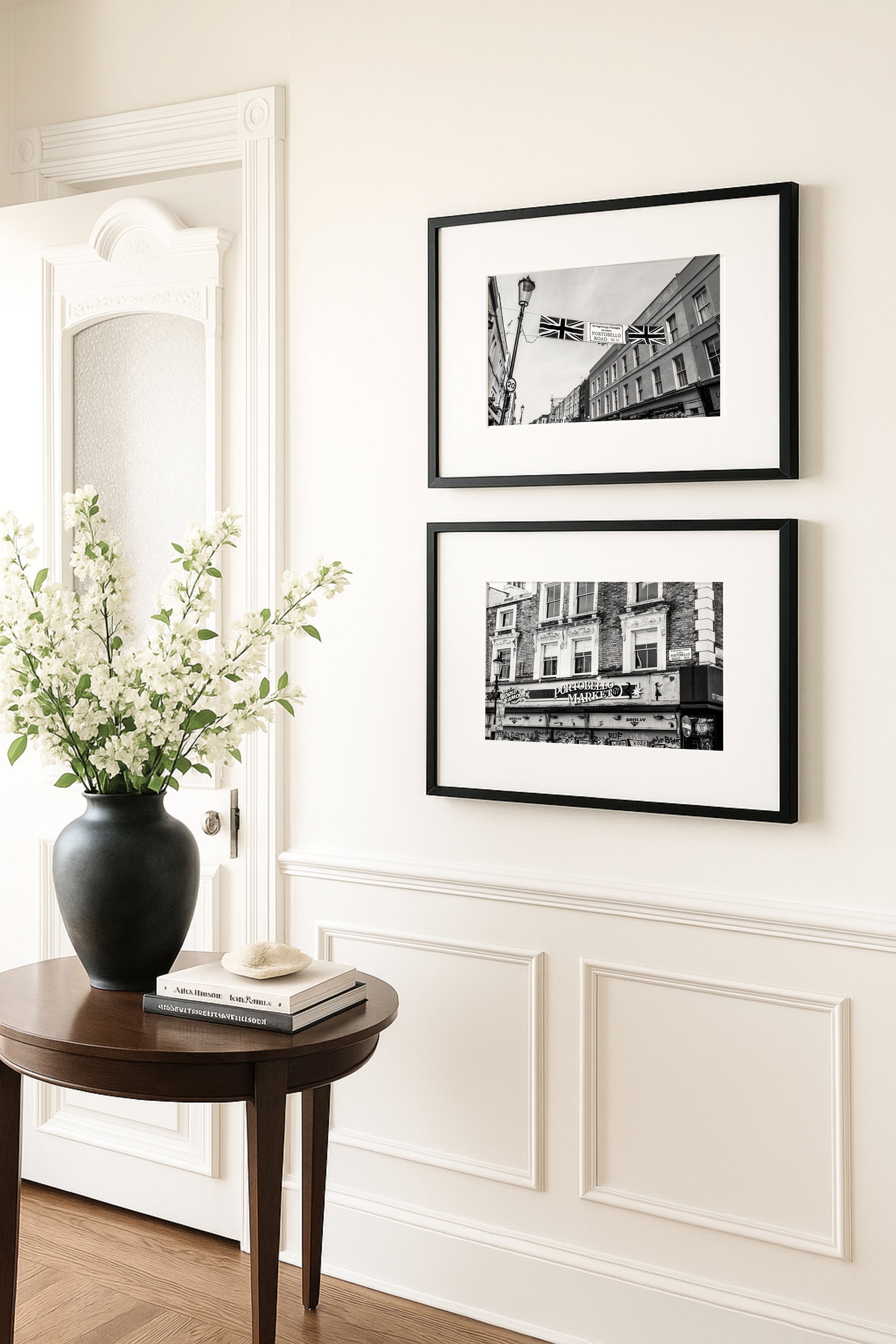 Black and white photograph of Portobello Road Market in Notting Hill, London featuring historic shops and a quiet city street scene.