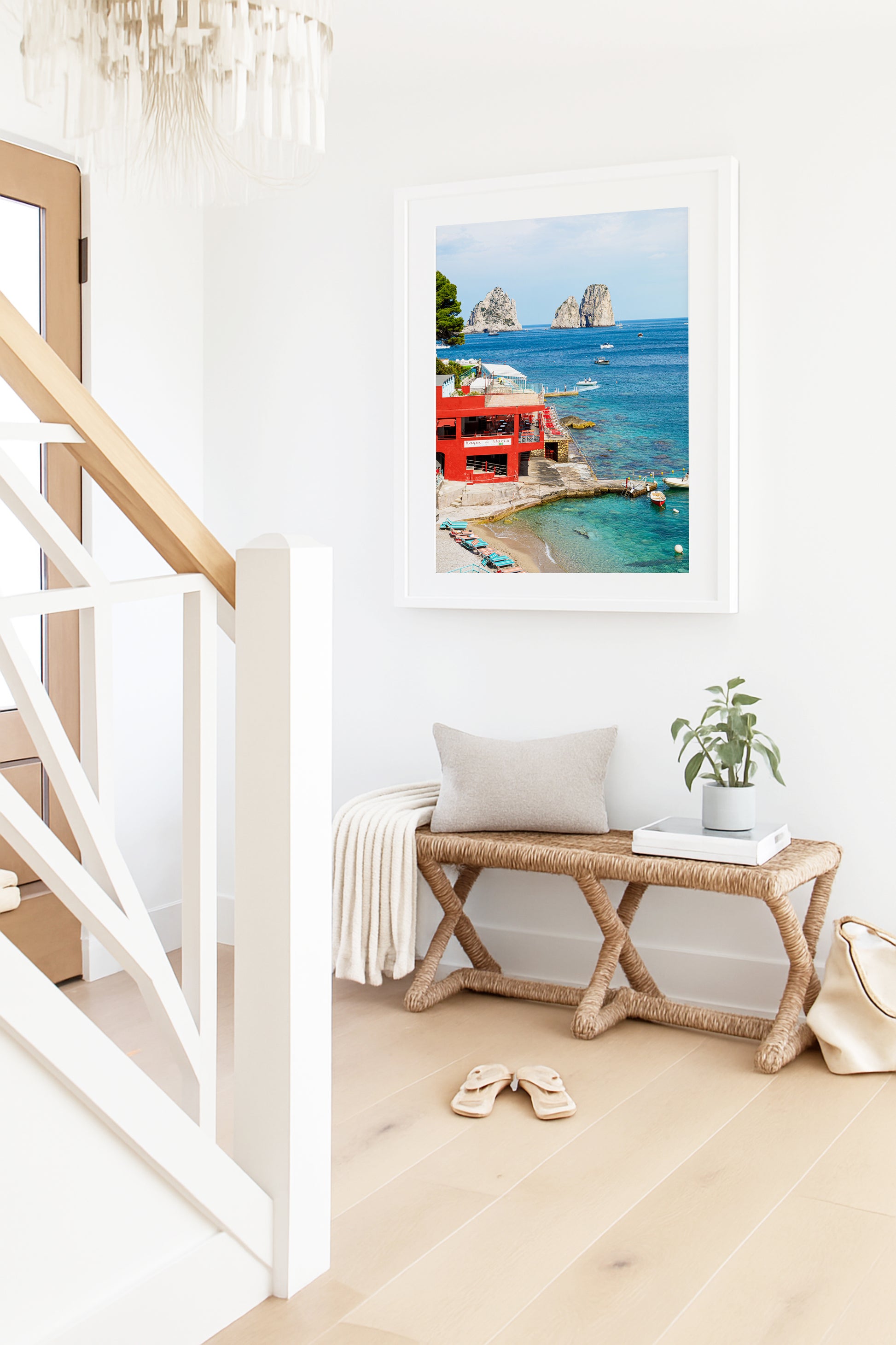 The red Bagni di Maria beach club at Marina Piccola with turquoise water and the iconic Faraglioni rock stacks rising from the sea, Capri, Italy