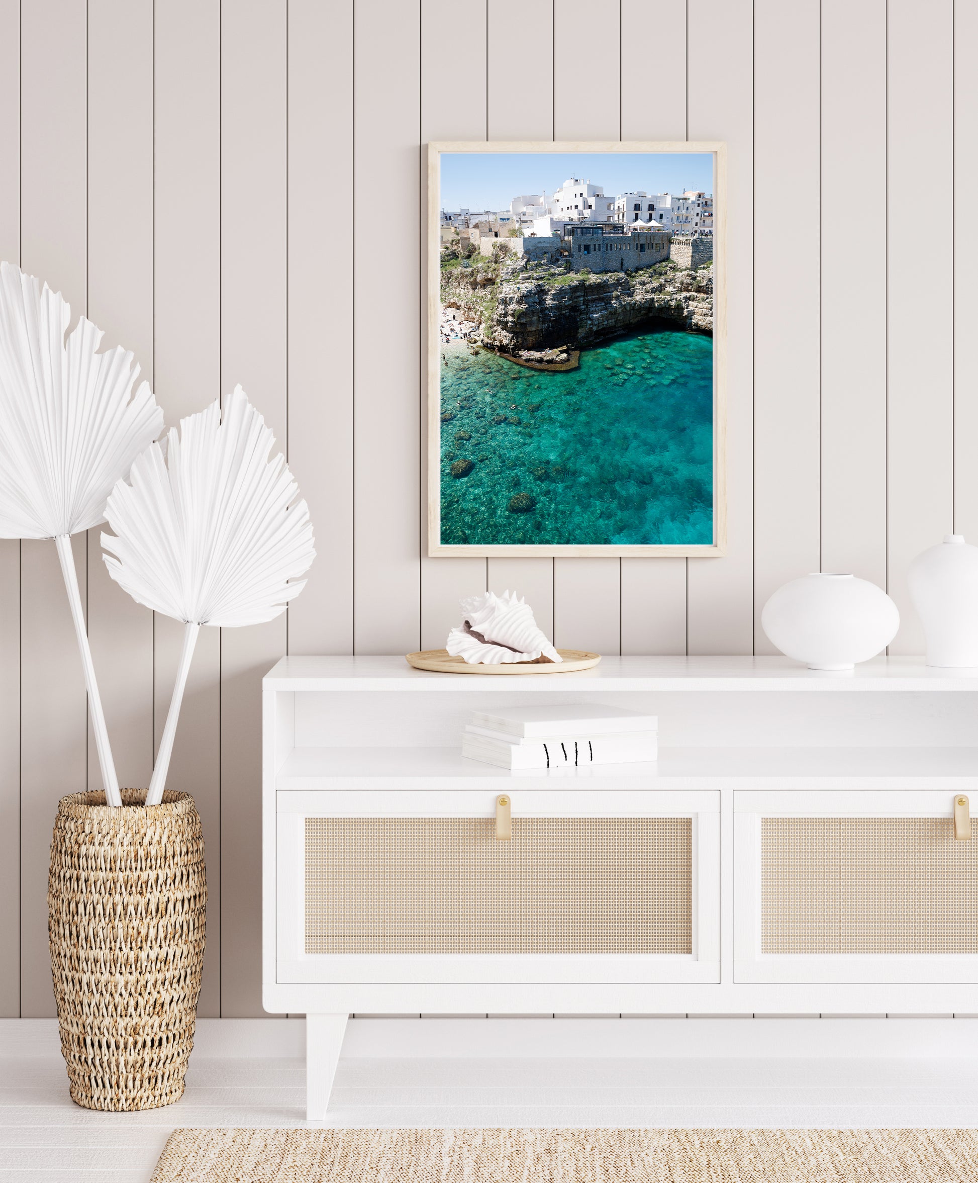 Aerial beach photo of Polignano a Mare with cliffs, turquoise sea, and Italian architecture in Puglia, Italy