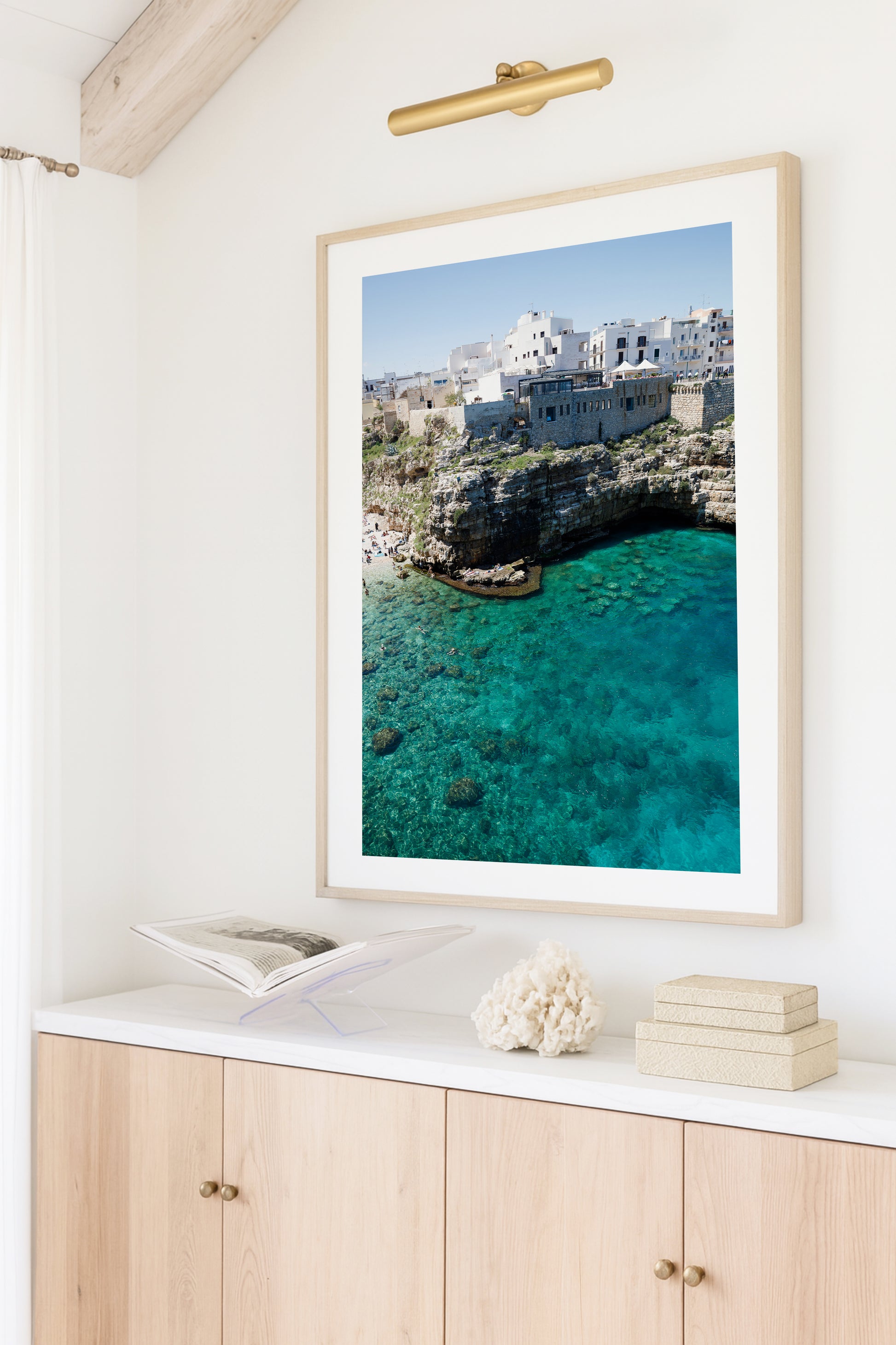Aerial beach photo of Polignano a Mare with cliffs, turquoise sea, and Italian architecture in Puglia, Italy