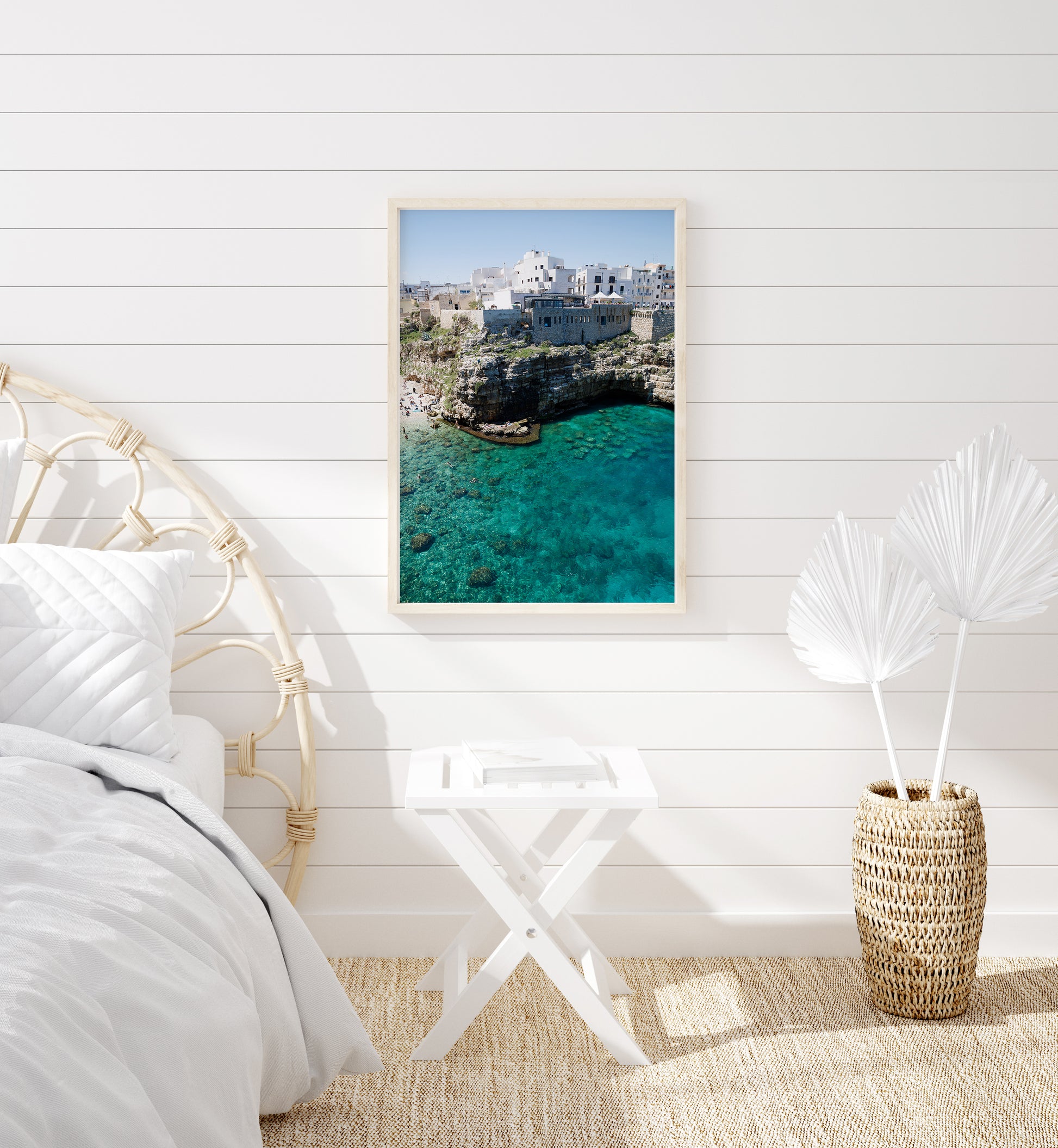 Aerial beach photo of Polignano a Mare with cliffs, turquoise sea, and Italian architecture in Puglia, Italy