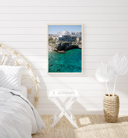 Aerial beach photo of Polignano a Mare with cliffs, turquoise sea, and Italian architecture in Puglia, Italy