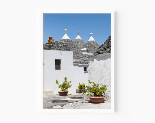 Alberobello Italy trulli architecture print with whitewashed walls and cone shaped roofs