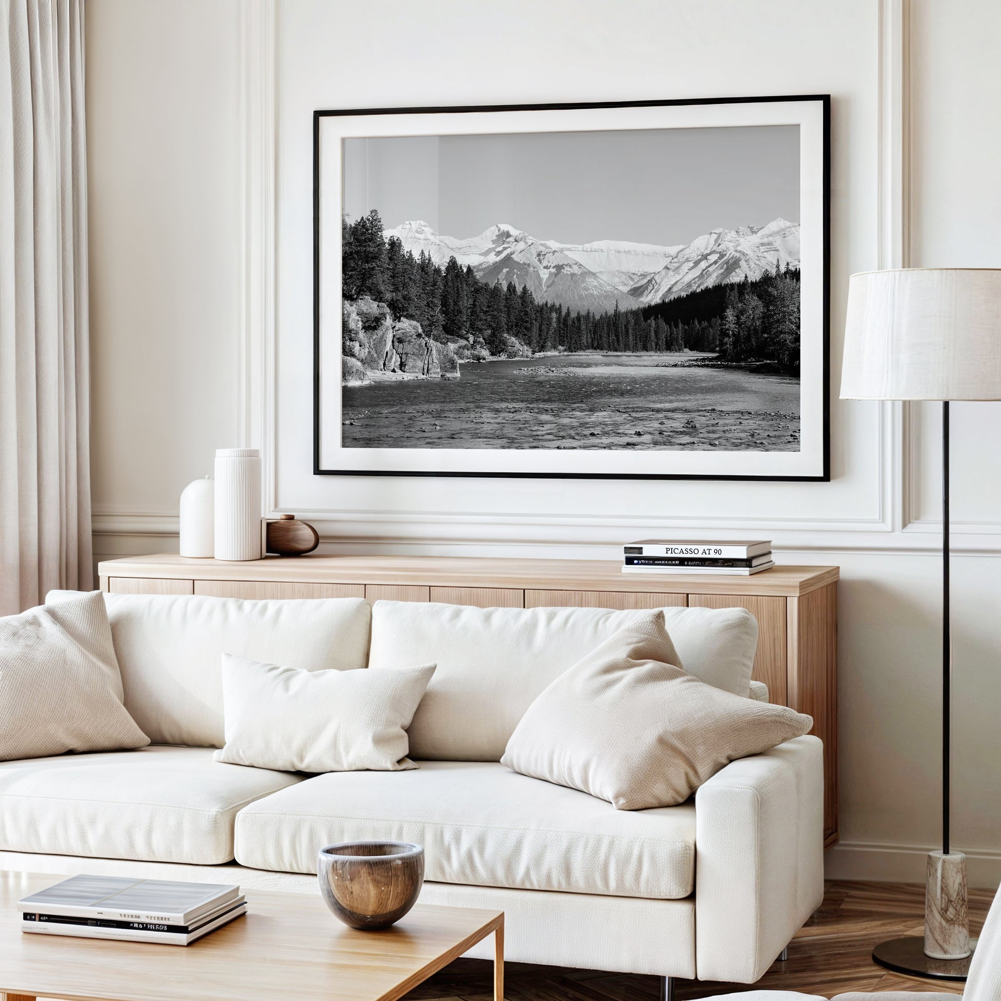 Black and white nature photography print of the Bow River in Banff National Park, with pine trees and Canadian Rockies in Alberta Canada.
