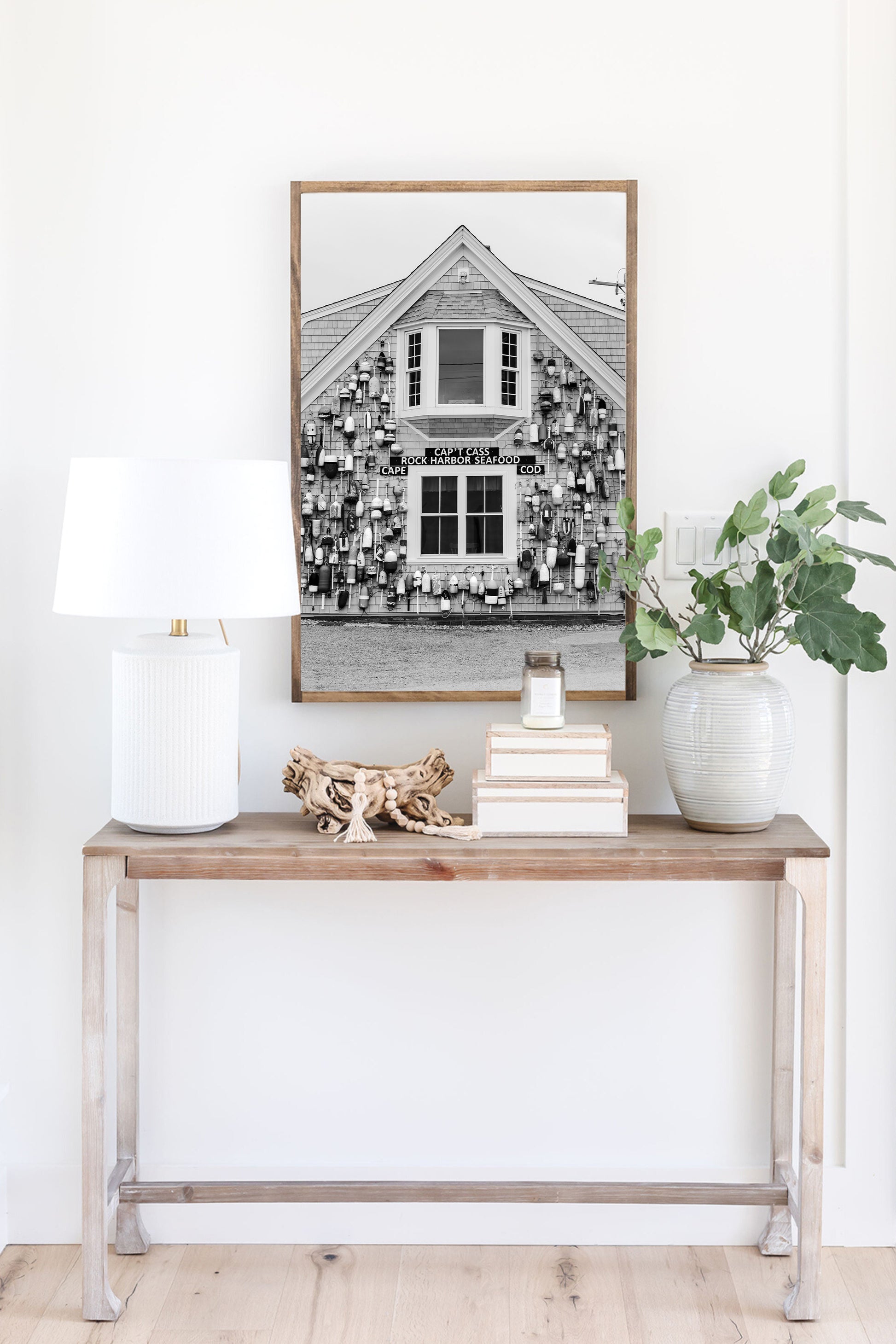 Black and white coastal wall art of Cape Cod seafood shack covered in lobster buoys — perfect for nautical and rustic New England decor.