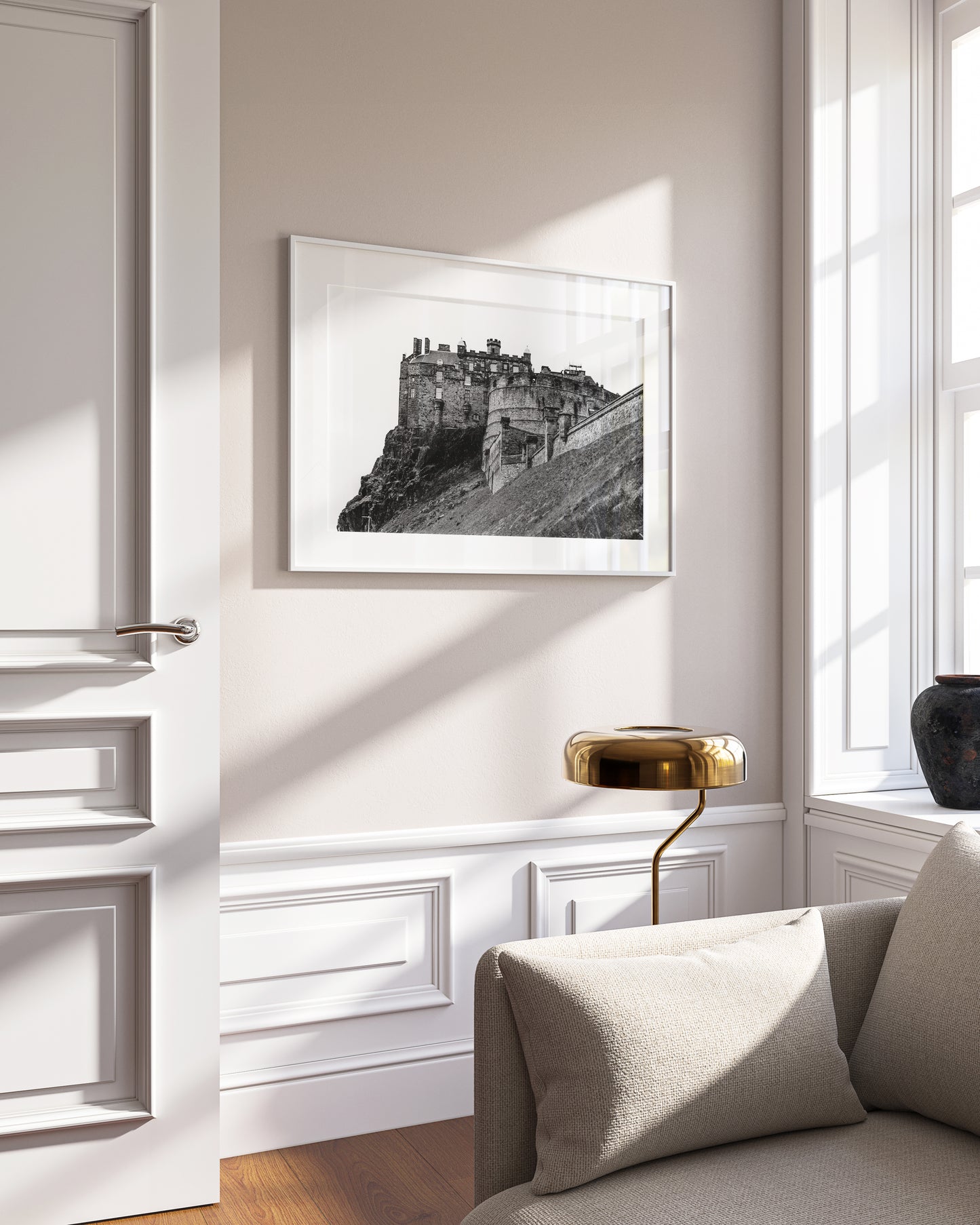 Black and white horizontal photo of Edinburgh Castle in Scotland with stone ramparts and cliffside – moody historic wall art