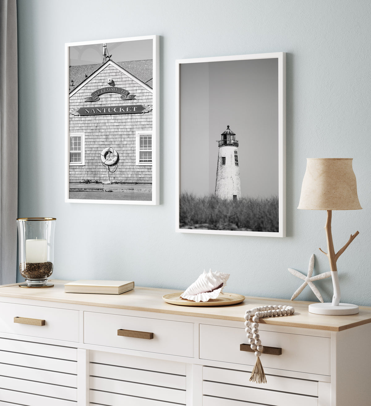 Black and white fine art photograph of Great Point Lighthouse and keeper's house on Nantucket Island — weathered white tower above dark dune grass against a flat grey sky, remote coastal wall art