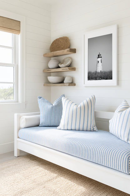 Black and white fine art photograph of Great Point Lighthouse and keeper's house on Nantucket Island — weathered white tower above dark dune grass against a flat grey sky, remote coastal wall art