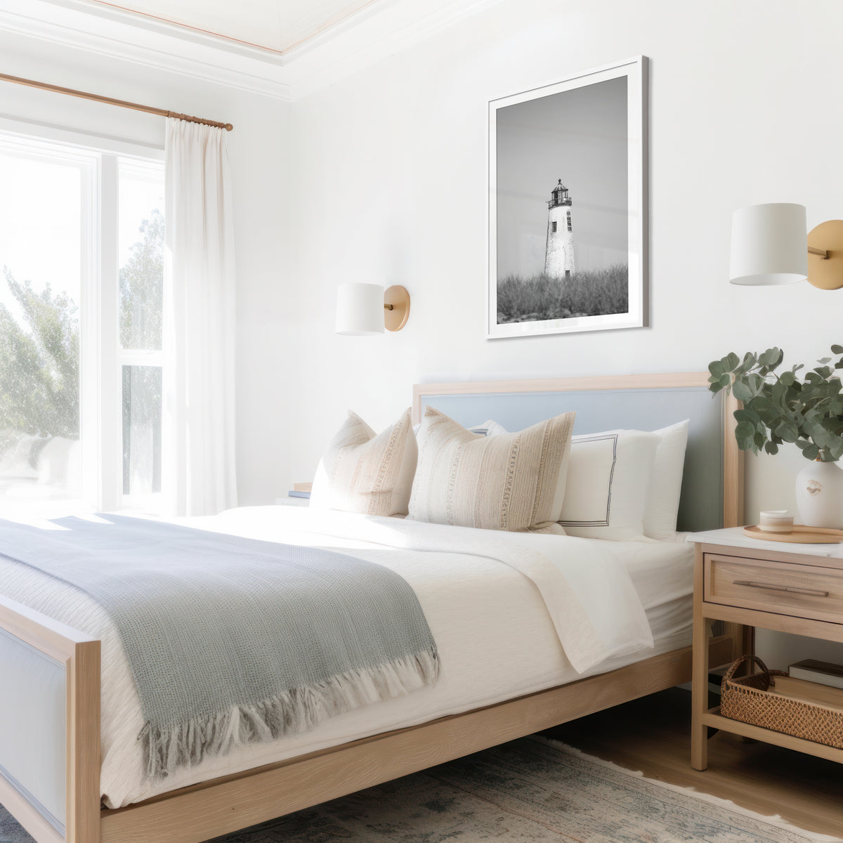 Black and white fine art photograph of Great Point Lighthouse and keeper's house on Nantucket Island — weathered white tower above dark dune grass against a flat grey sky, remote coastal wall art