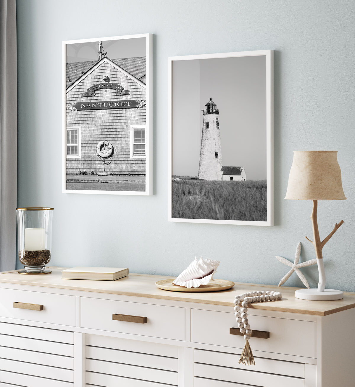 Black and white fine art photograph of Great Point Lighthouse on Nantucket Island — weathered white tower rising above dark dune grass against a flat grey sky, minimalist coastal wall art