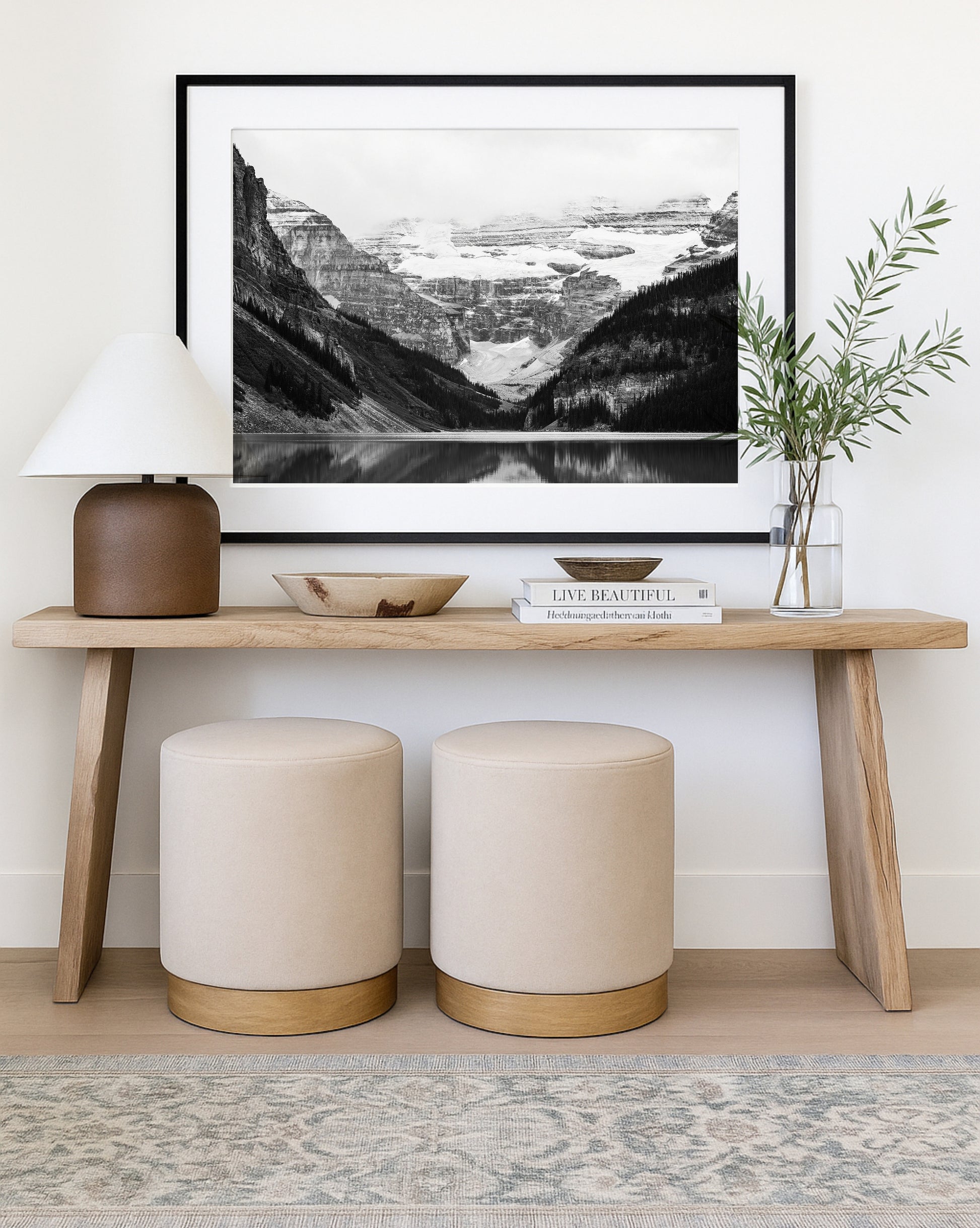 Black and white photo of Lake Louise in Banff National Park, Alberta Canada with mountains reflected in the Canadian Rockies