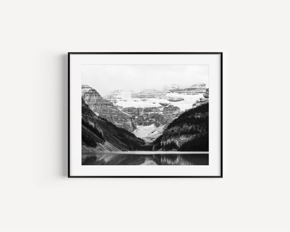 Black and white photo of Lake Louise in Banff National Park, Alberta Canada with mountains reflected in the Canadian Rockies
