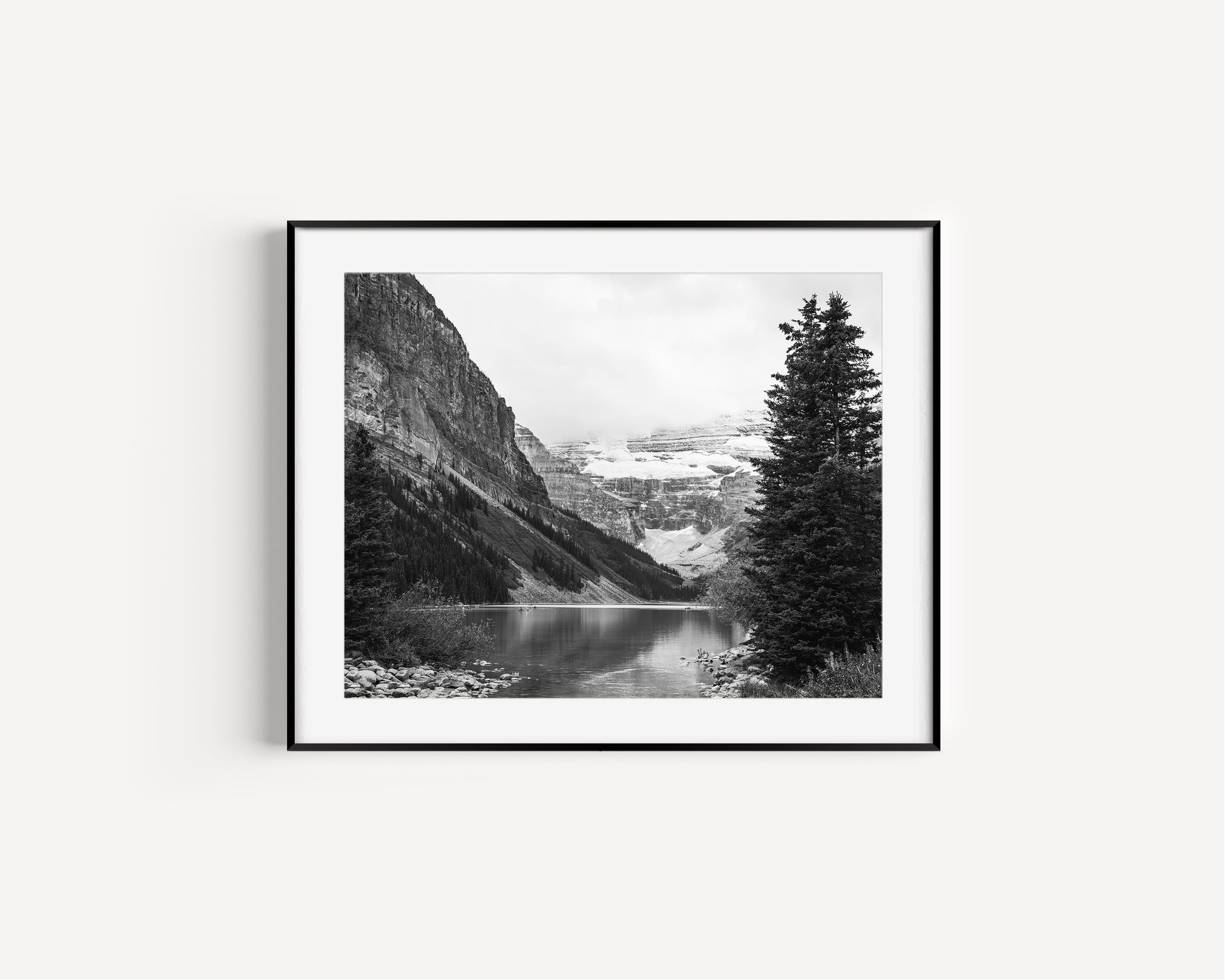 Black and white Lake Louise print in Banff National Park, Alberta Canada featuring a serene mountain lake in the Canadian Rockies