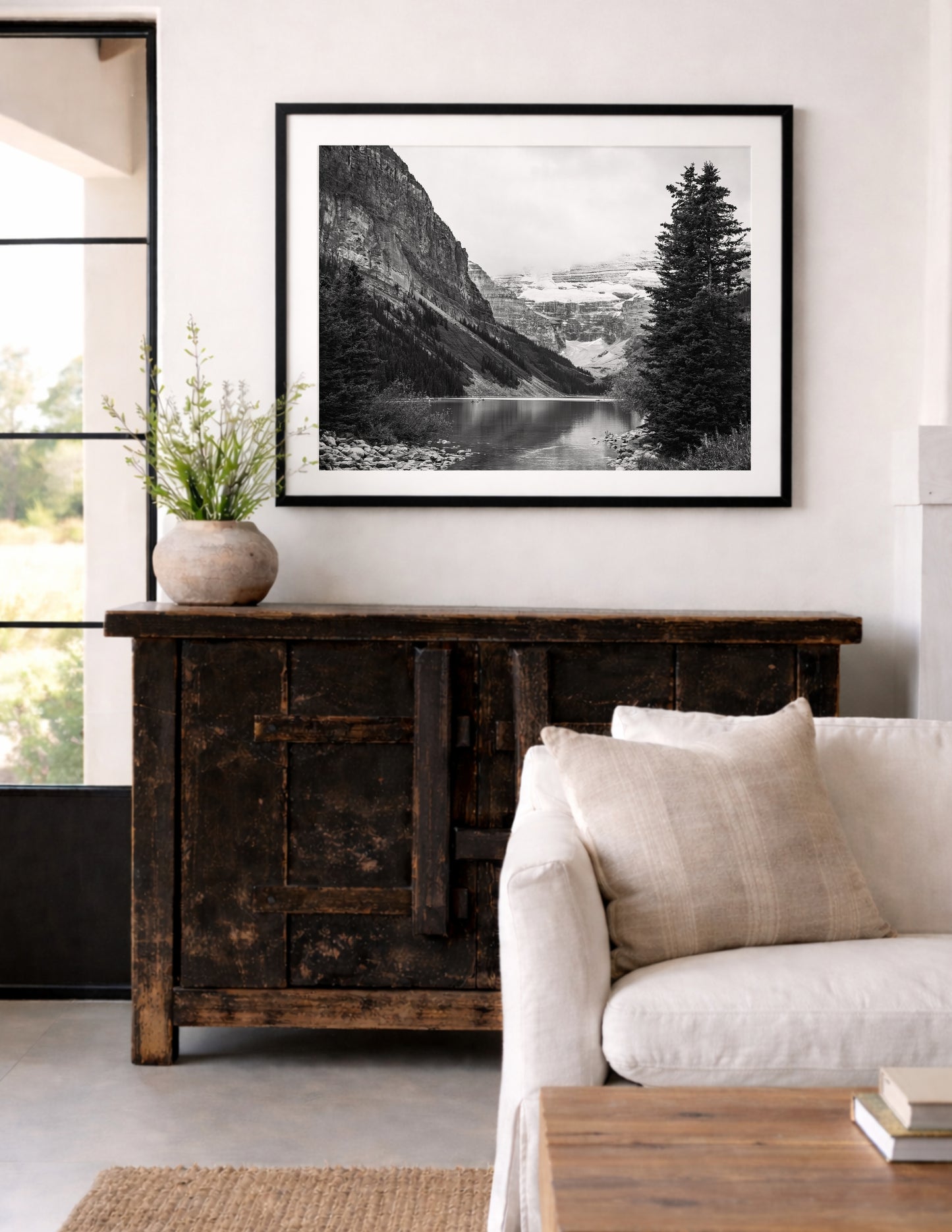 Black and white Lake Louise print in Banff National Park, Alberta Canada featuring a serene mountain lake in the Canadian Rockies