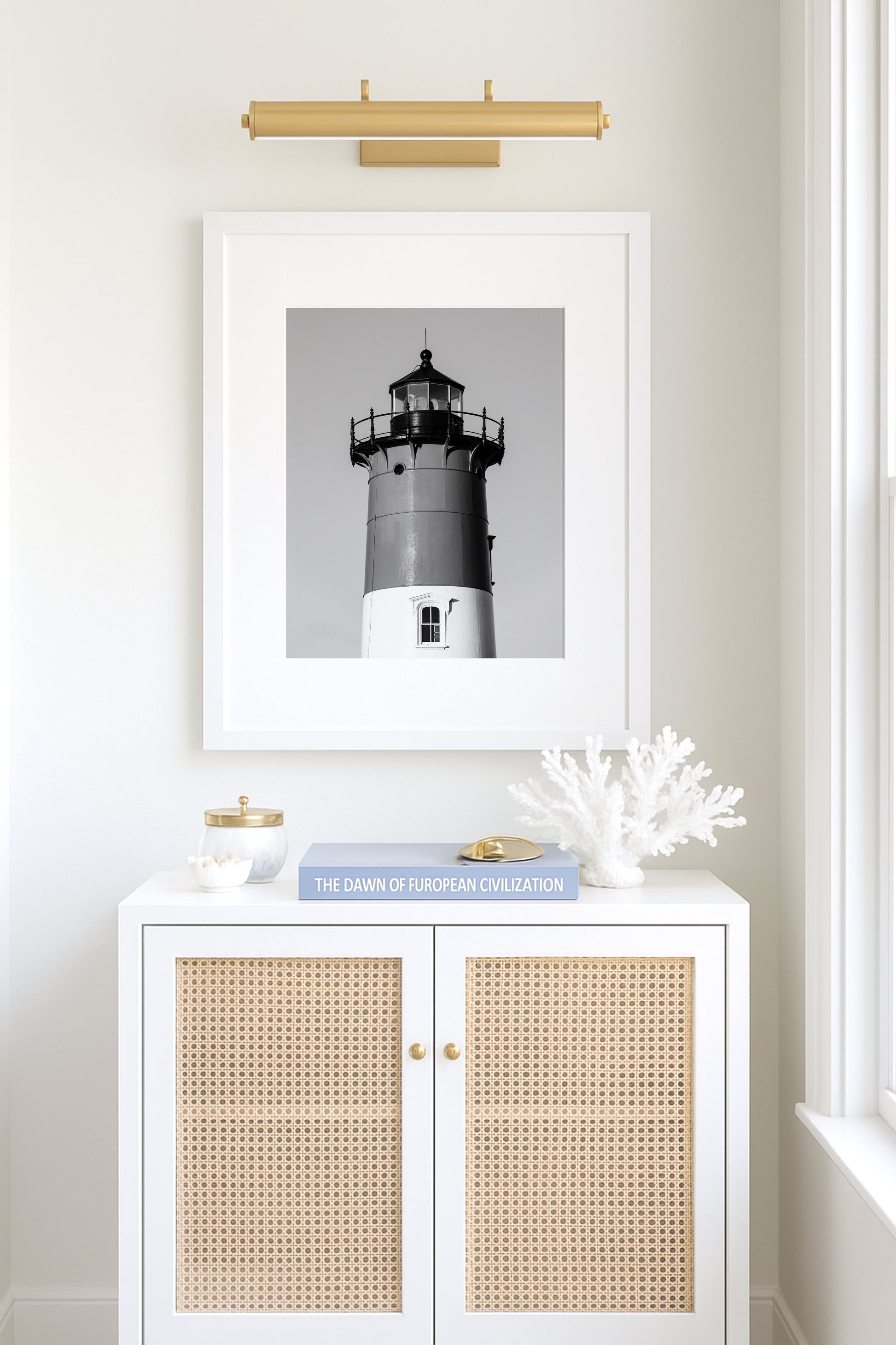 Black and white photograph of Nauset Lighthouse in Eastham, Massachusetts, featuring the iconic tower set against a pale sky. A minimalist coastal print ideal for Cape Cod–inspired decor and nautical wall art.
