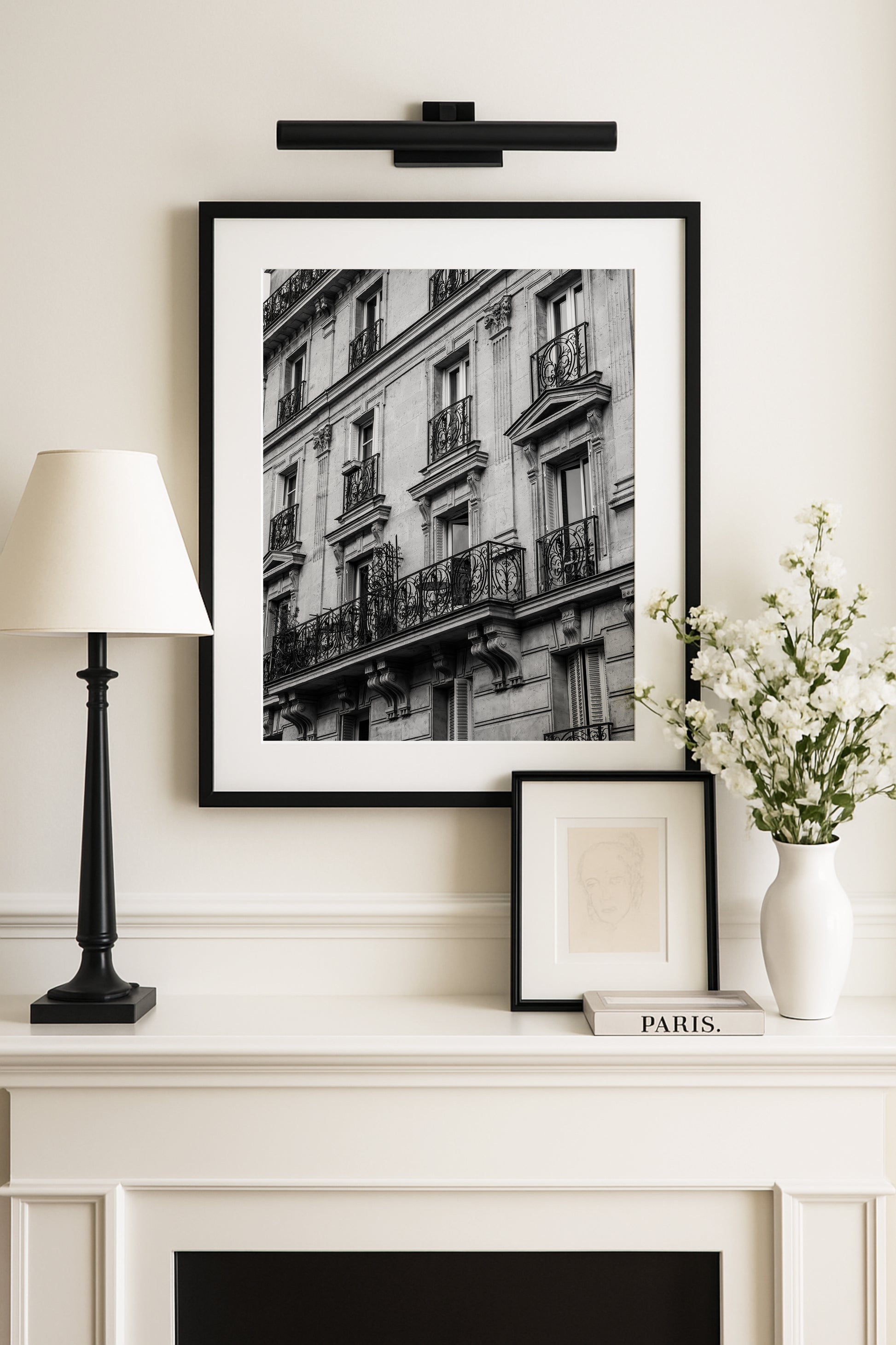 Black and white photo of French balcony with ornate railings in Paris