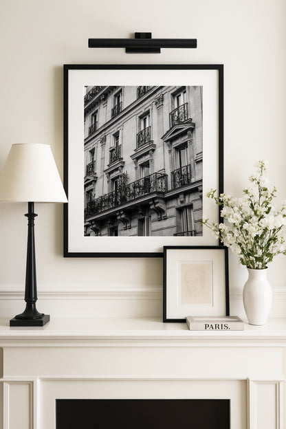Black and white photo of French balcony with ornate railings in Paris
