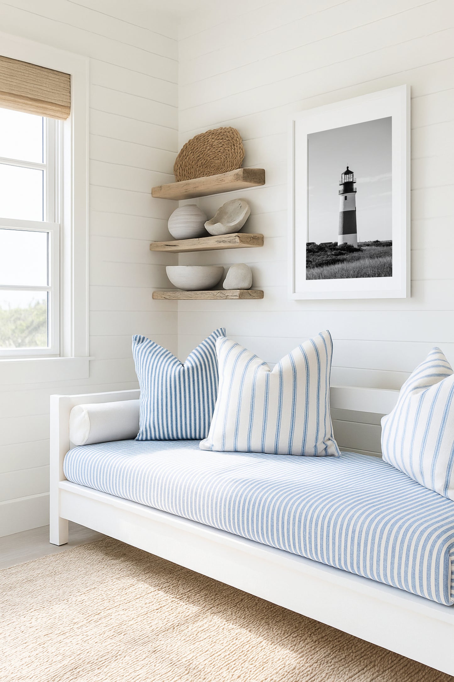 Black and white fine art photograph of Sankaty Head Lighthouse on Nantucket Island — banded tower rising above wild moor grass against an open sky in Siasconset