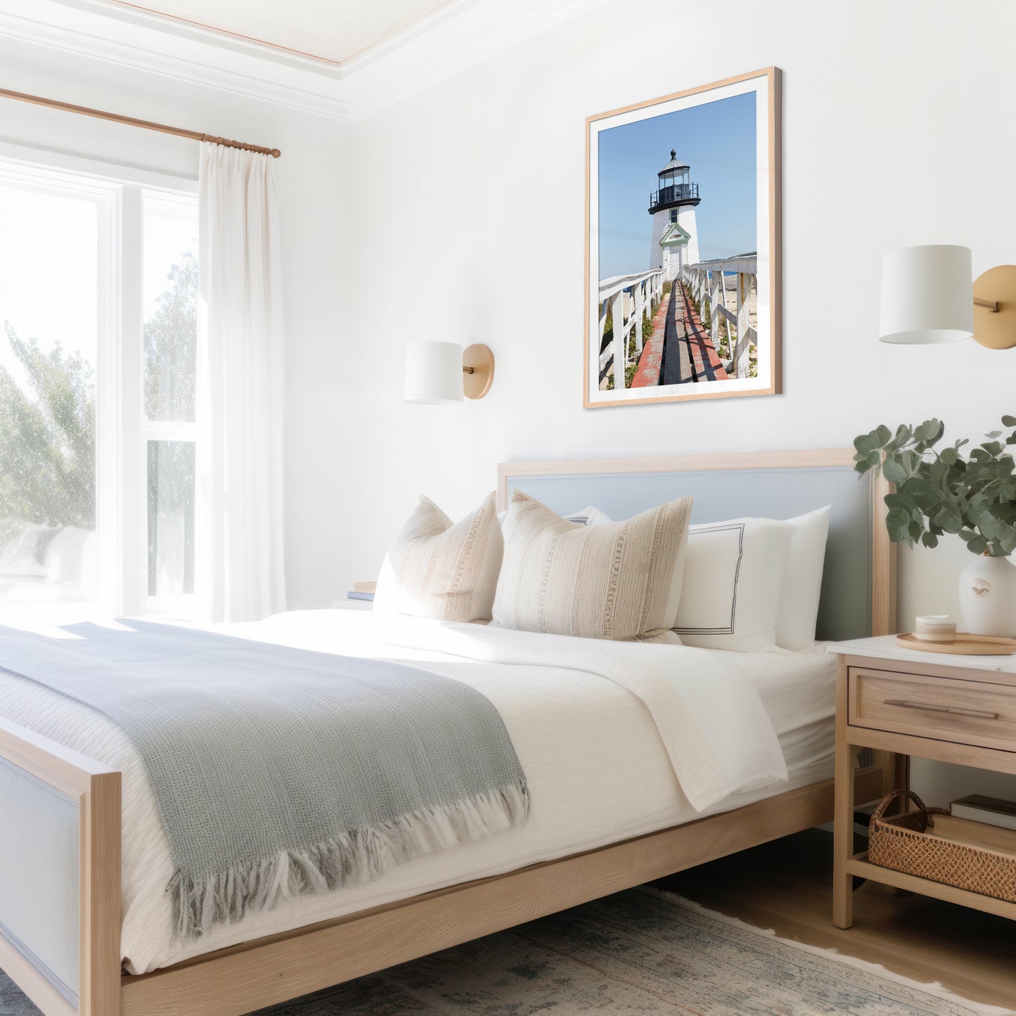 Vertical photograph of Brant Point Lighthouse in Nantucket, viewed straight down the weathered boardwalk with a bright blue sky and soft coastal light.