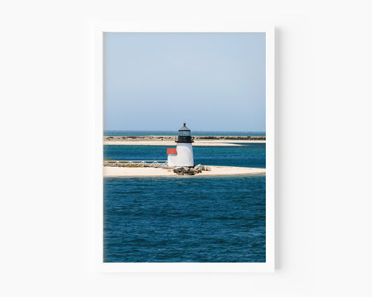 Nantucket Brant Point Lighthouse color photography print — white lighthouse on sandy harbor point, deep blue ocean, coastal New England wall art for beach house or living room
