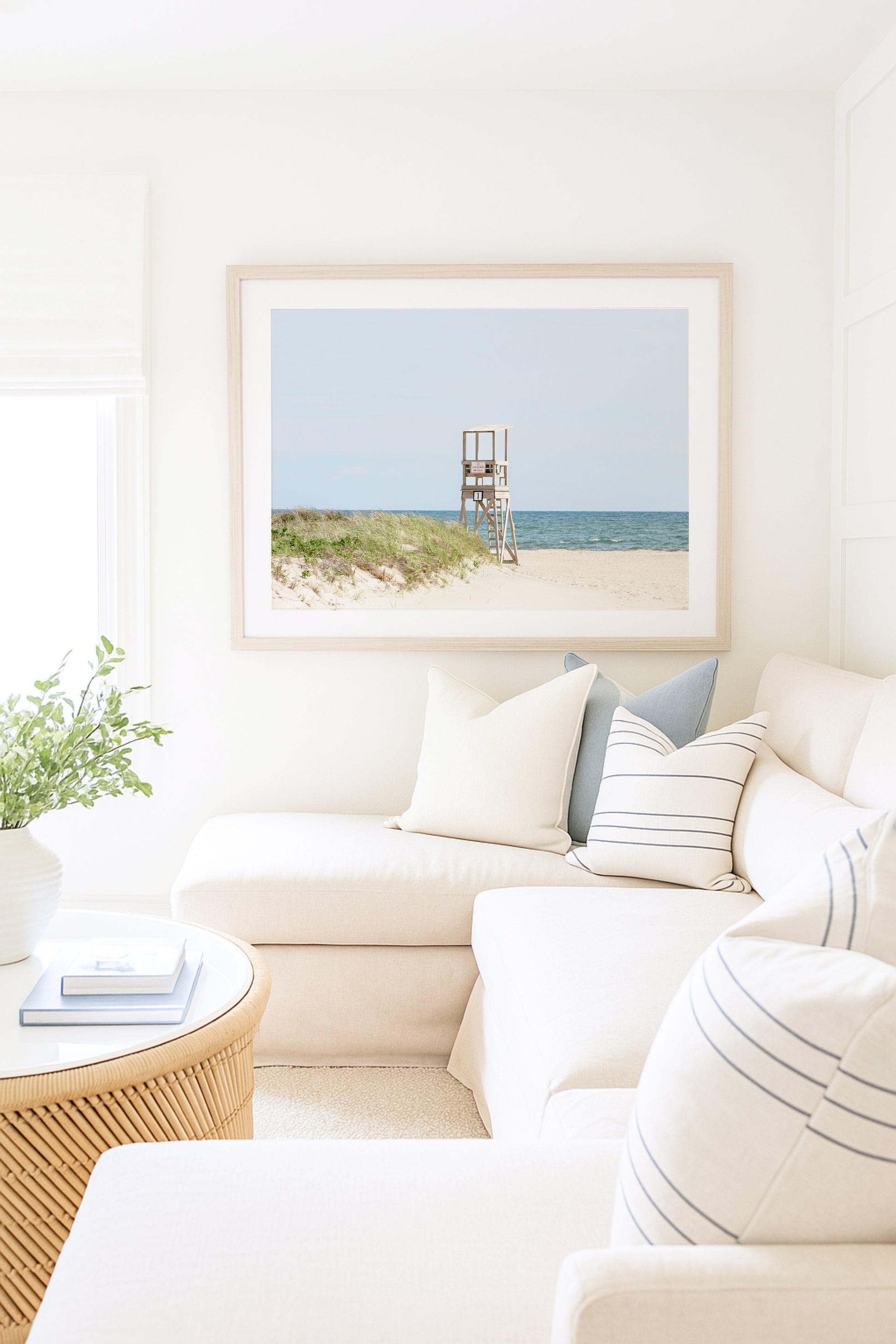Color fine art photograph of an empty lifeguard stand at Bank Street Beach on Cape Cod — rolling sand dunes, sea grass, and the open Atlantic under a pale summer sky