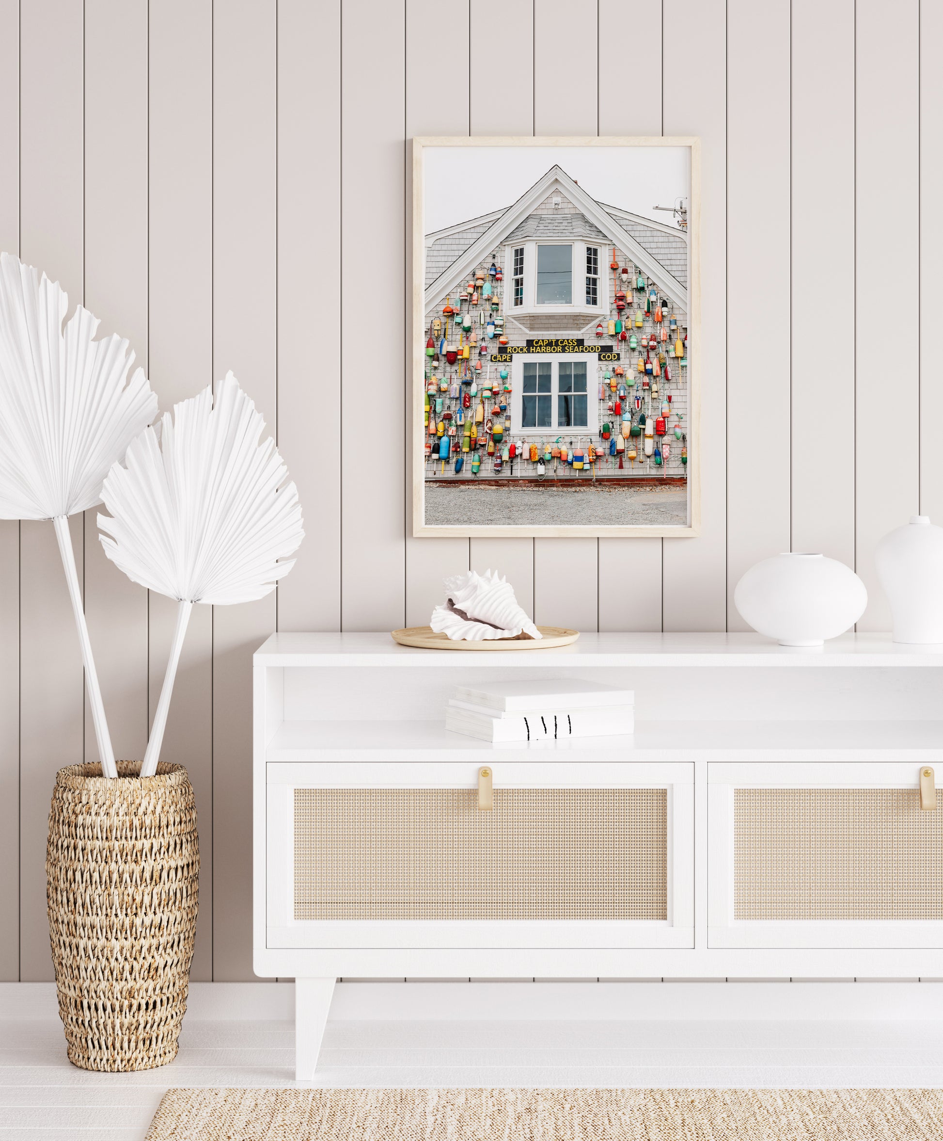 Photograph of a Cape Cod seafood shack covered in colorful fishing buoys, perfect for coastal wall decor and beach cottage interiors