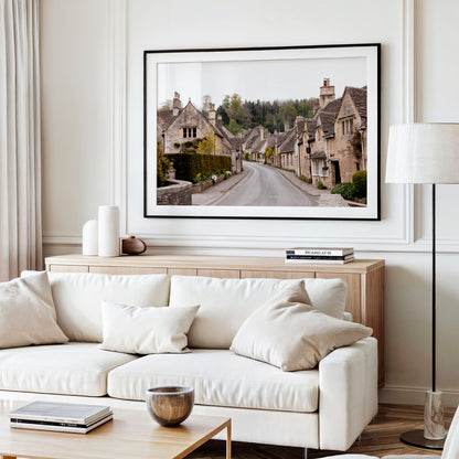 Photography print of Castle Combe village in the Cotswolds England featuring historic stone cottages and winding road