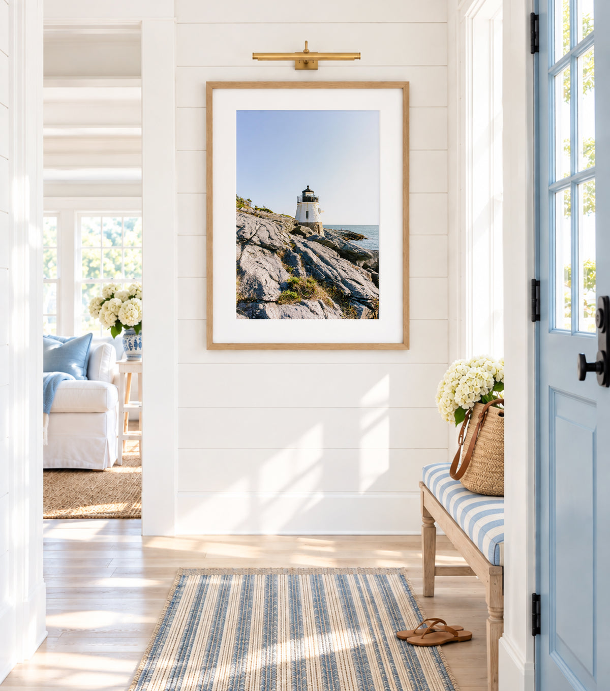 Castle Hill Lighthouse perched on rocky Rhode Island coastline under a clear sky, captured in golden hour light – Newport RI photo print for beach and coastal decor.