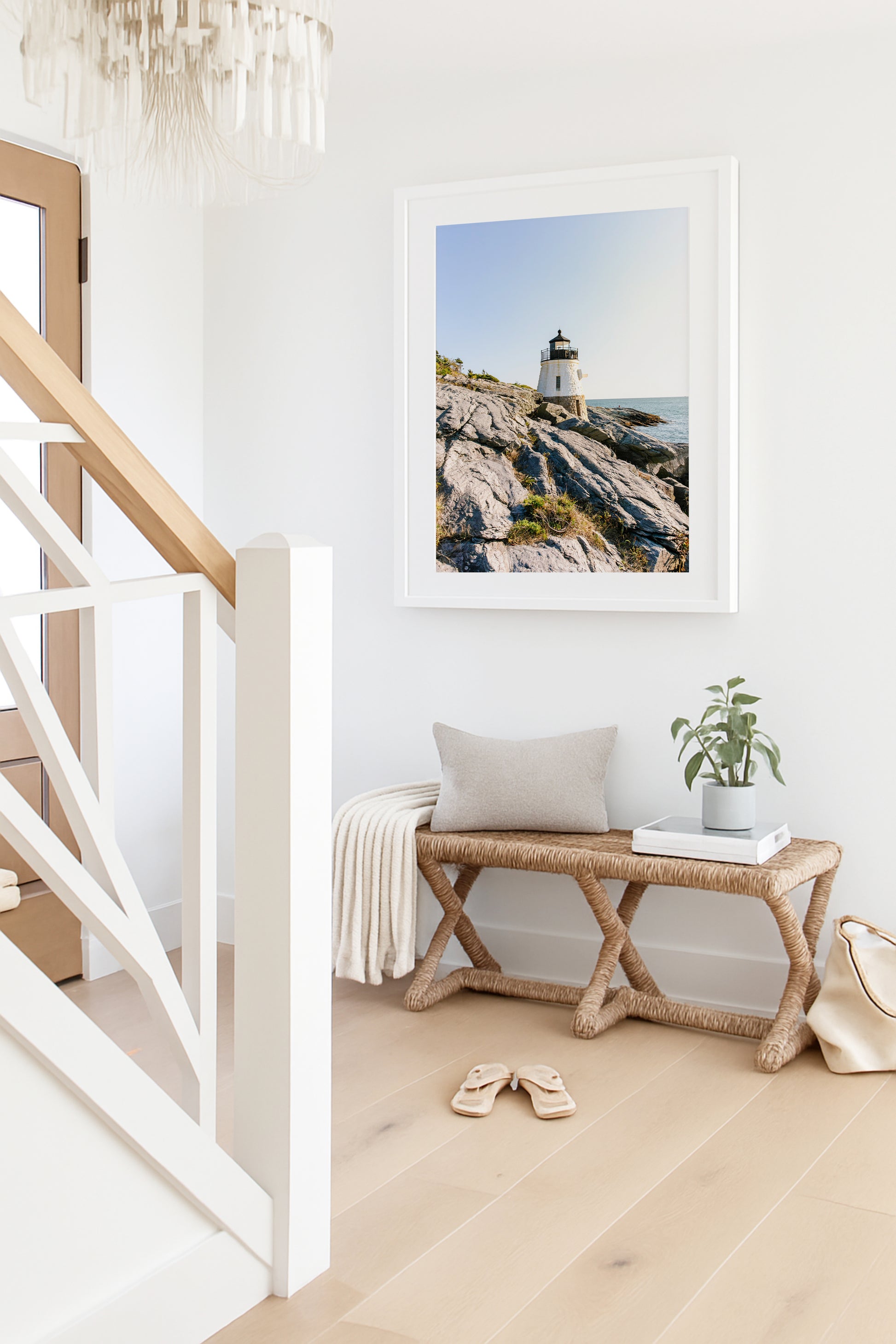 Castle Hill Lighthouse perched on rocky Rhode Island coastline under a clear sky, captured in golden hour light – Newport RI photo print for beach and coastal decor.