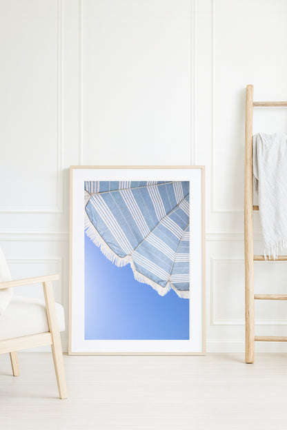 Blue and white beach umbrella print photographed in Santa Barbara Cali against clear blue sky