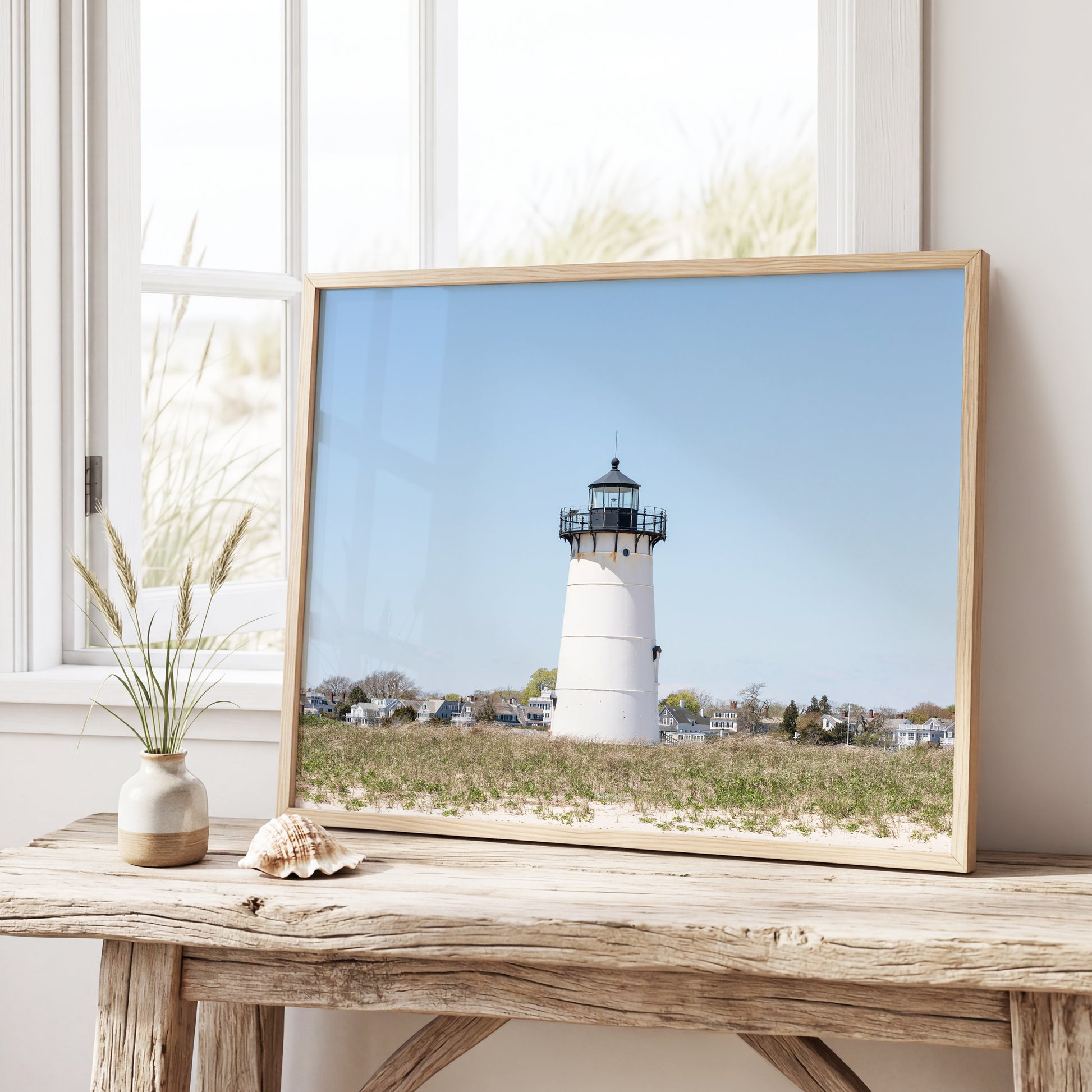 Horizontal coastal photography print of Edgartown Lighthouse on Marthas Vineyard with dune grass, blue sky, and beach landscape.