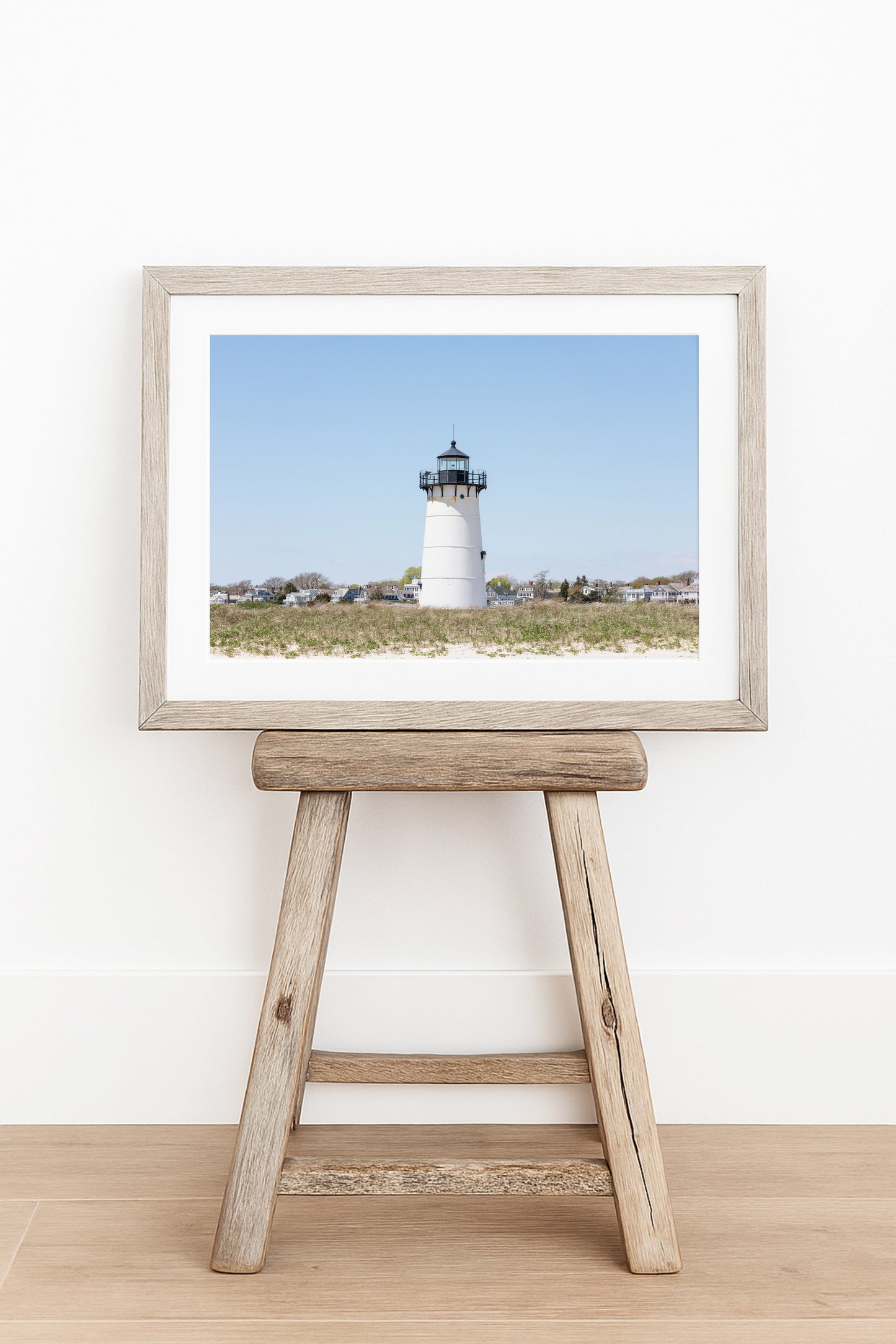 Horizontal coastal photography print of Edgartown Lighthouse on Marthas Vineyard with dune grass, blue sky, and beach landscape.