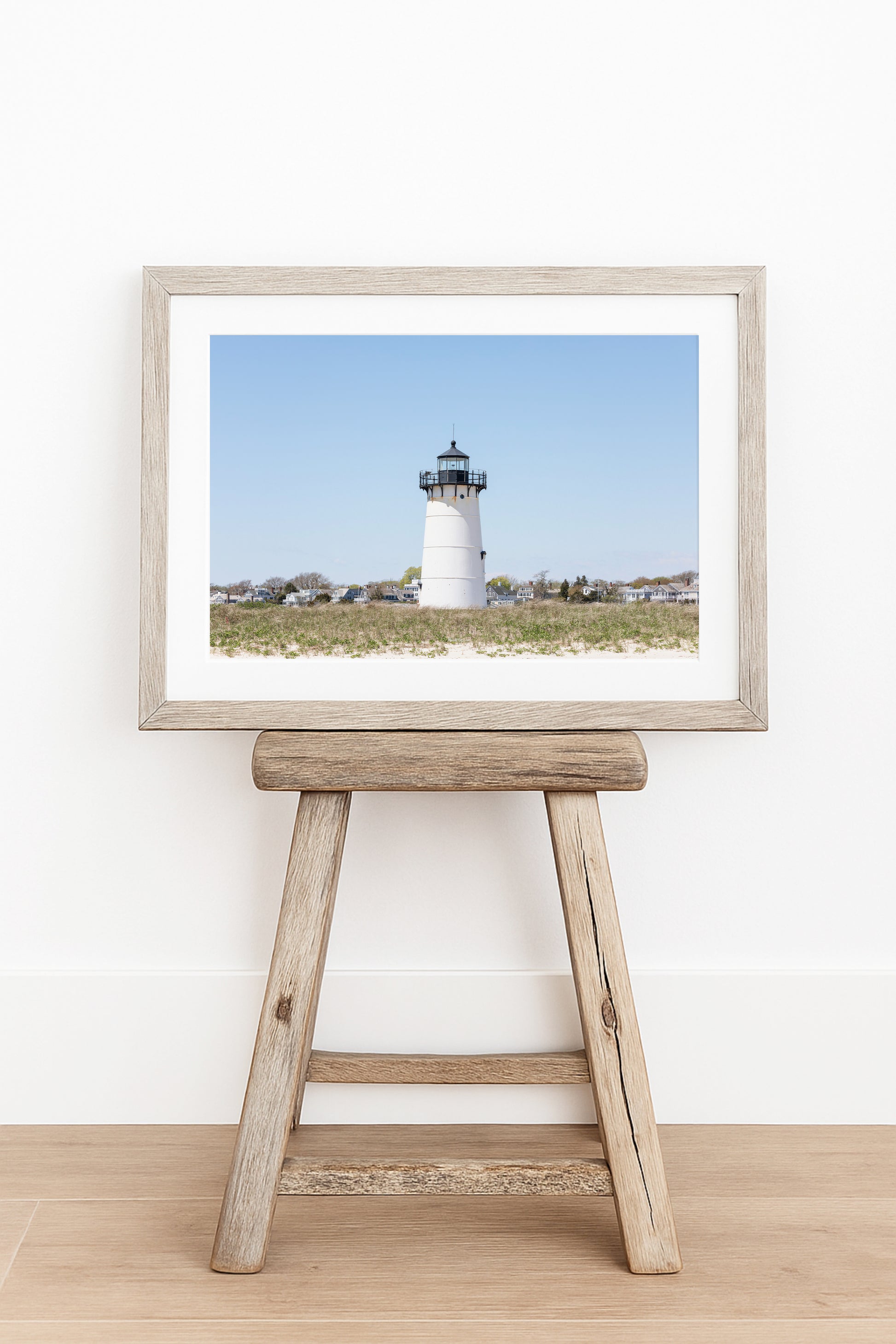 Horizontal coastal photography print of Edgartown Lighthouse on Marthas Vineyard with dune grass, blue sky, and beach landscape.