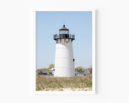 Edgartown Lighthouse photography print on Marthas Vineyard featuring a white lighthouse, dune grass, and soft blue sky in a coastal New England setting.