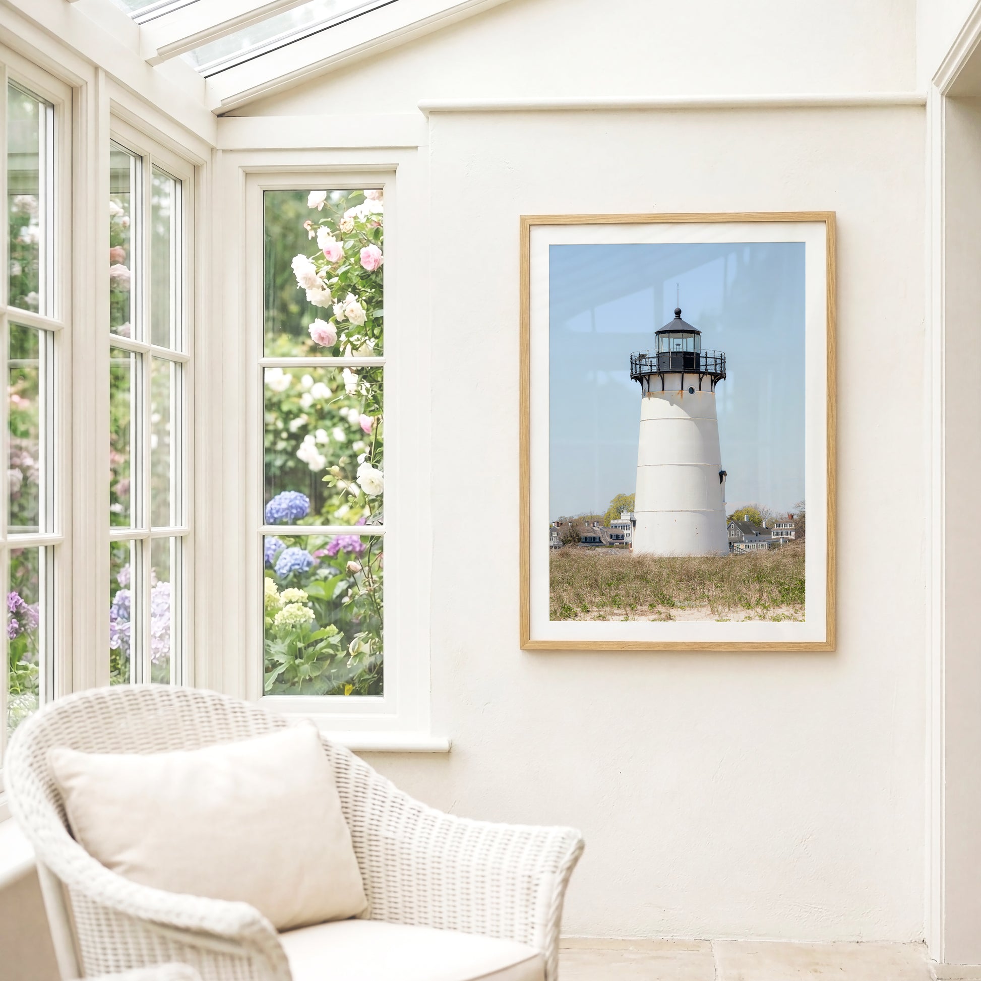 Edgartown Lighthouse photography print on Marthas Vineyard featuring a white lighthouse, dune grass, and soft blue sky in a coastal New England setting.