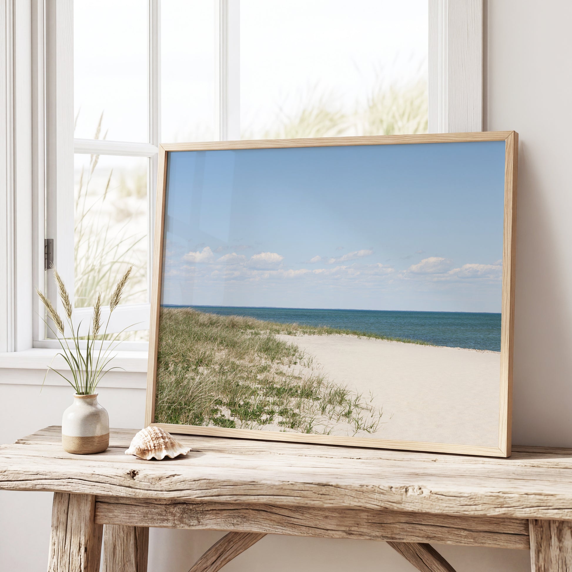 Neutral Marthas Vineyard beach print featuring sandy dunes, beach grass, soft blue ocean water, and a bright coastal sky.