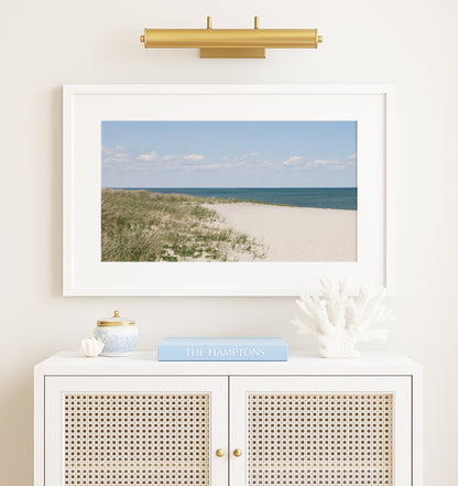 Neutral Marthas Vineyard beach print featuring sandy dunes, beach grass, soft blue ocean water, and a bright coastal sky.