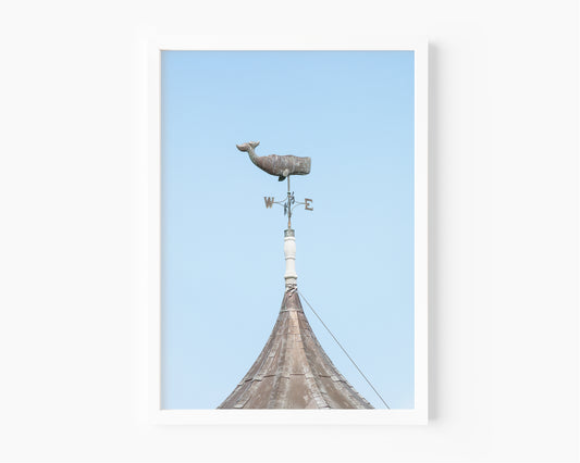 Whale weathervane Martha’s Vineyard photography print, weathered nautical weathervane on copper rooftop against pale blue sky, New England coastal wall art for beach house, cottage, or living room