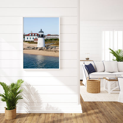 Brant Point Lighthouse print in Nantucket, featuring a white tower, rocky shoreline, and blue sky—ideal for nautical and coastal wall decor.