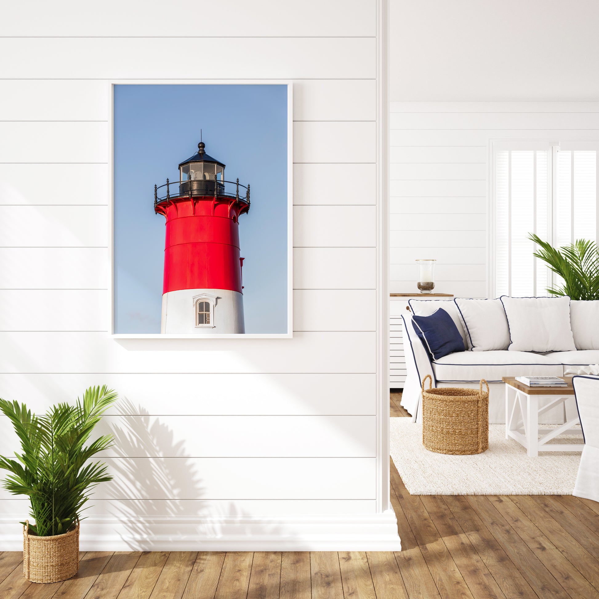 Vertical photograph of the red and white Nauset Lighthouse in Eastham, Massachusetts, set against a clear blue sky with no dunes or beach in view