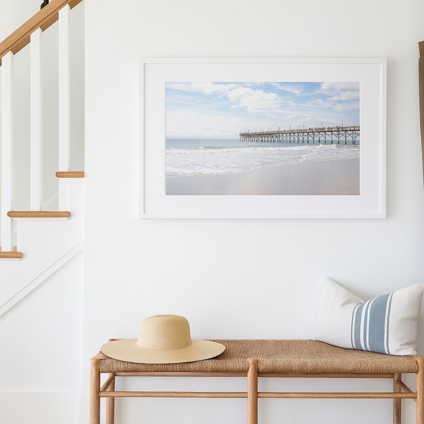 Light and airy photo of Ocean Isle Pier on a bright day, with waves rolling in under a soft sky—perfect for coastal decor and North Carolina homes.