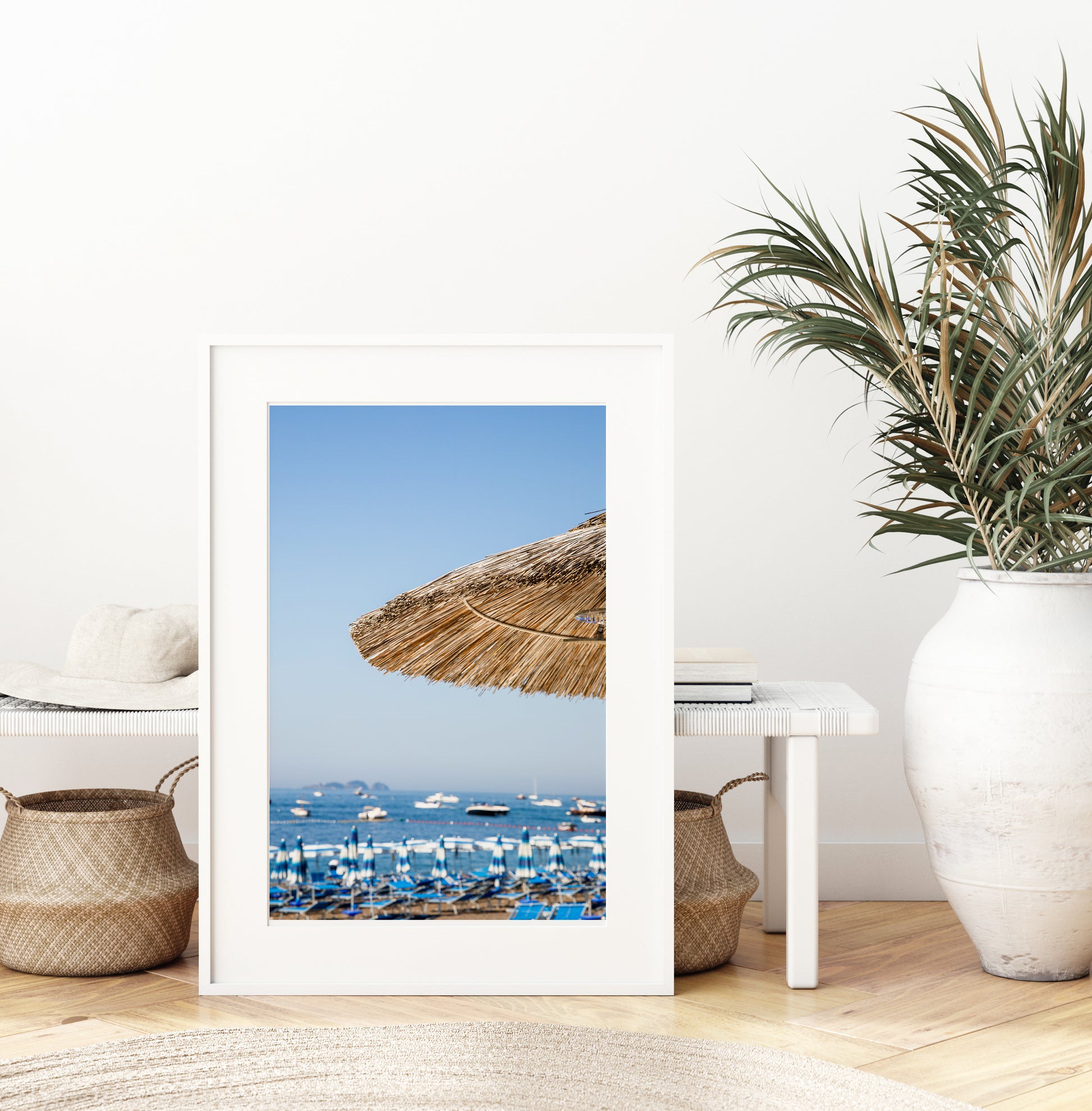 Positano beach photography print with straw umbrella and Amalfi Coast sea view – modern coastal wall art for beach house or Airbnb decor