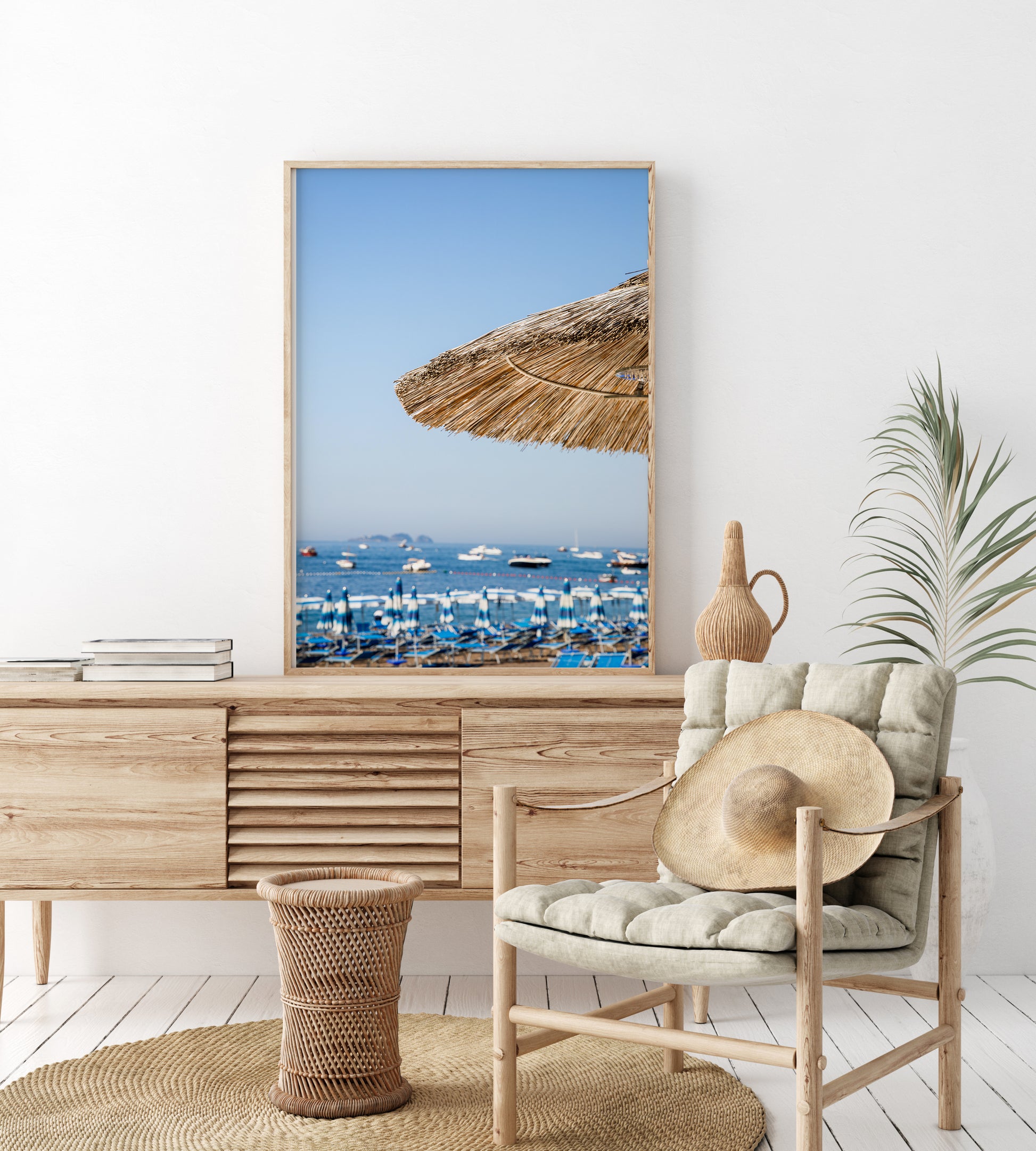 Positano beach photography print with straw umbrella and Amalfi Coast sea view – modern coastal wall art for beach house or Airbnb decor