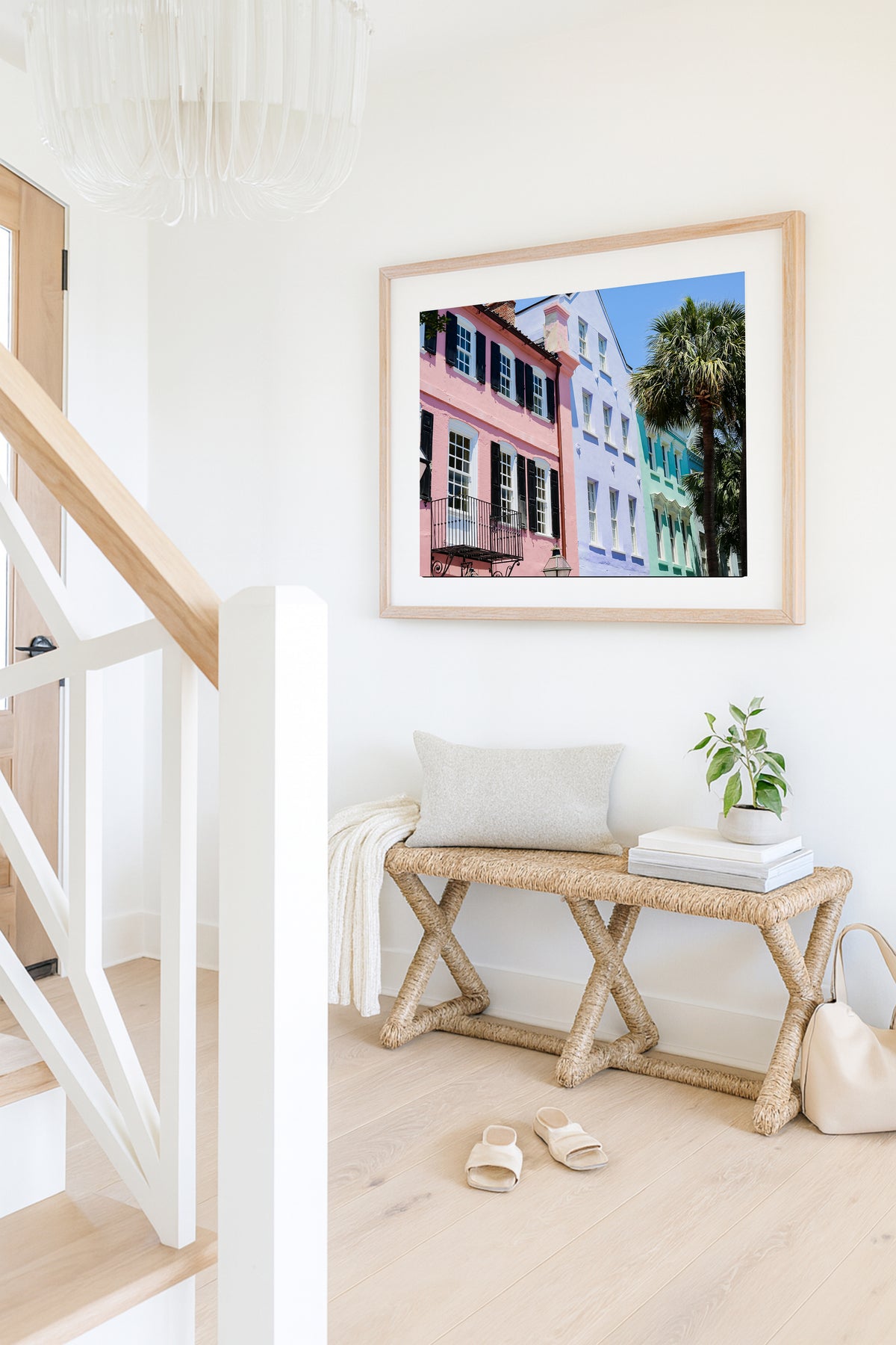 Color fine art photograph of Rainbow Row on East Bay Street in Charleston, South Carolina — pink, lavender, and mint green pastel facades with wrought iron balconies and palm trees against a blue sky