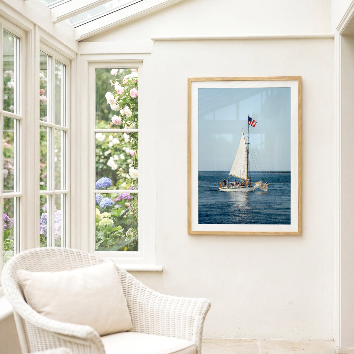 Nantucket Harbor sailboat photography print, classic wooden sailing vessel with American flag on deep blue water, coastal nautical wall art for beach house, living room, or home office